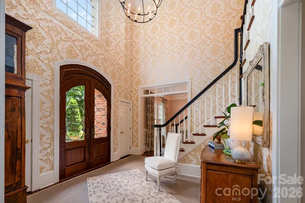 a view of entryway with wooden floor and windows