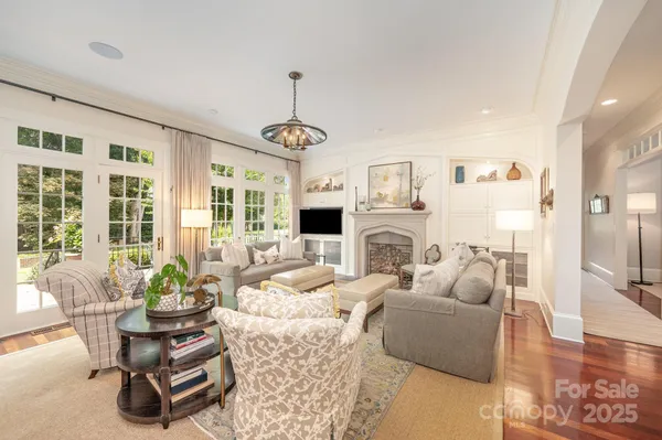 a kitchen with stainless steel appliances granite countertop a stove and wooden floor