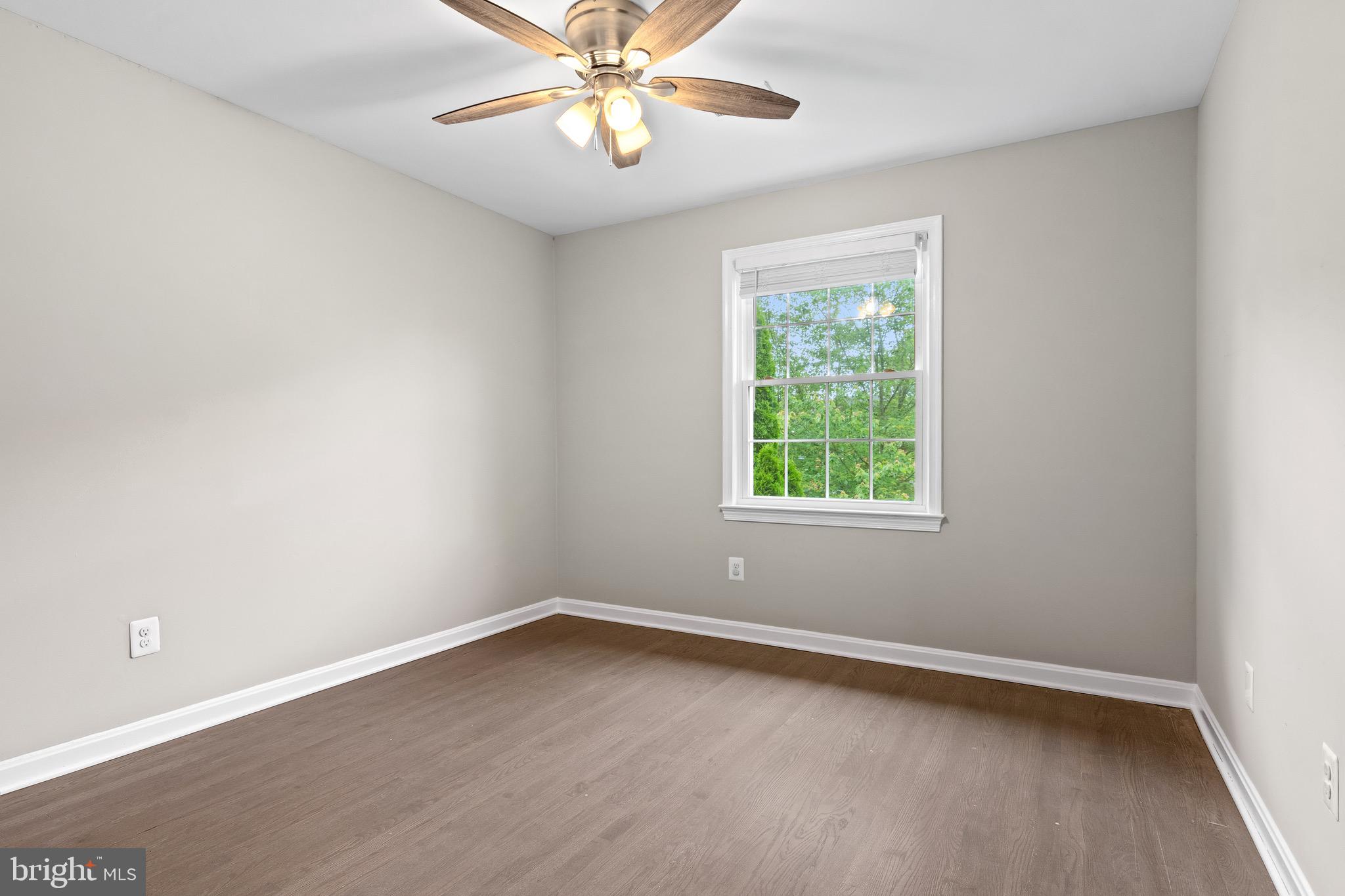4727 Exeter Street Annandale, VA 22003 - Photo 19 of 35 an empty room with a window and wooden floor