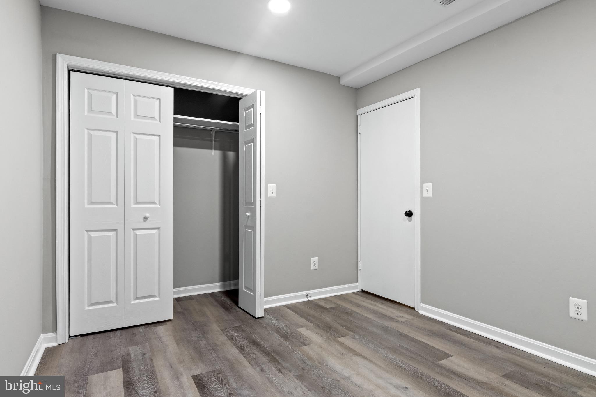 4727 Exeter Street Annandale, VA 22003 - Photo 27 of 35 an empty room with wooden floor and closet area