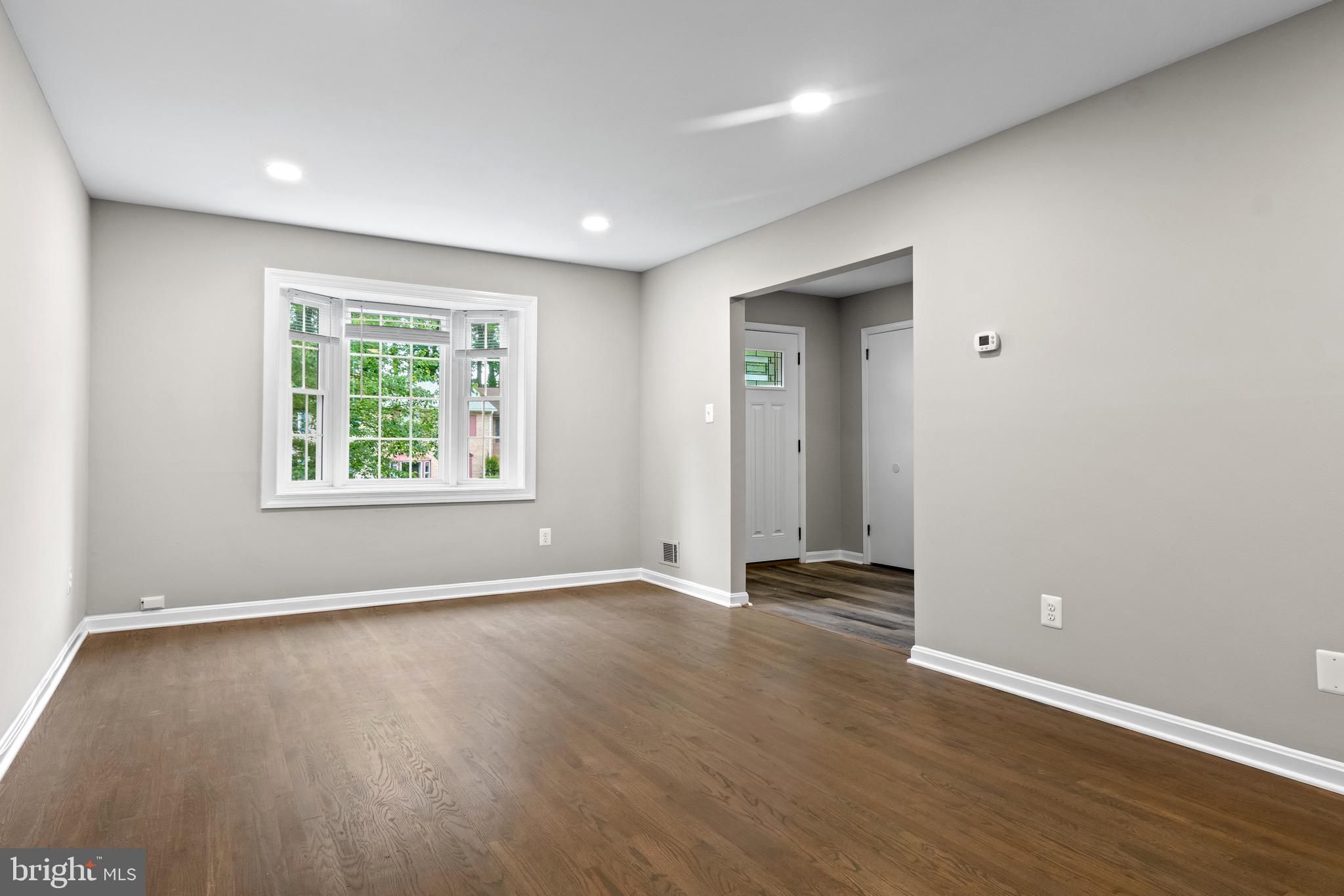4727 Exeter Street Annandale, VA 22003 - Photo 4 of 35 an empty room with wooden floor and windows