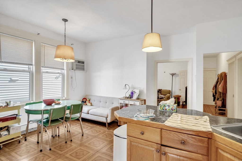 33 Shannon Street, Unit 1 Boston, MA 02135 - Photo 6 of 15 a living room with furniture a window and a chandelier