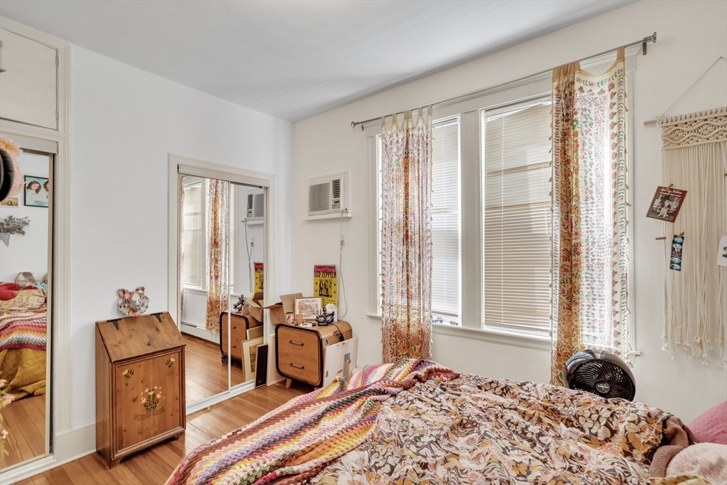 33 Shannon Street, Unit 1 Boston, MA 02135 - Photo 8 of 15 a bedroom with furniture and large windows