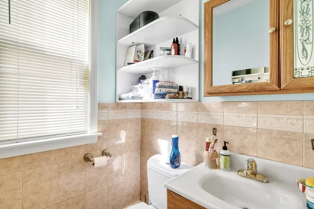 a bathroom with a sink and a window