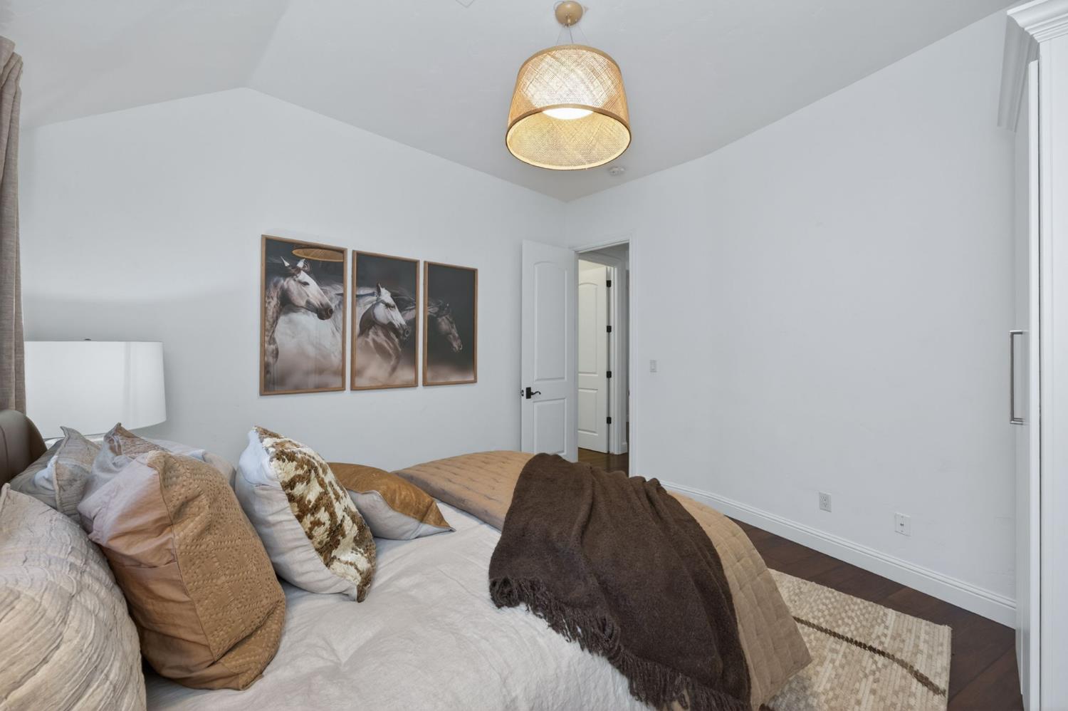 601 Decatur Avenue Clovis, CA 93611 - Photo 33 of 62 a bedroom with a bed and a painting on the wall