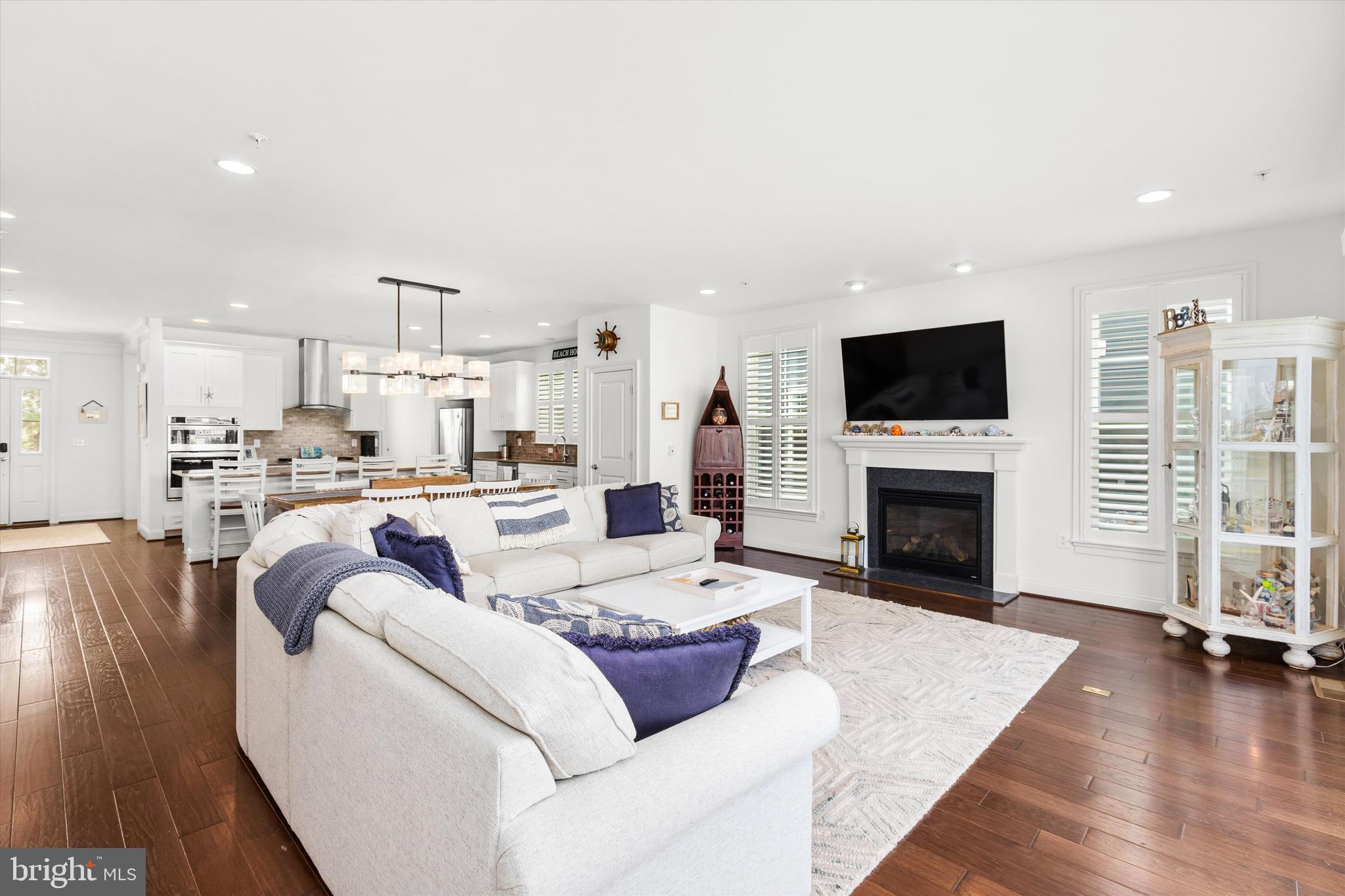 10119 Fast Colors Lane Berlin, MD 21811 - Photo 11 of 43 a living room with furniture fireplace and flat screen tv