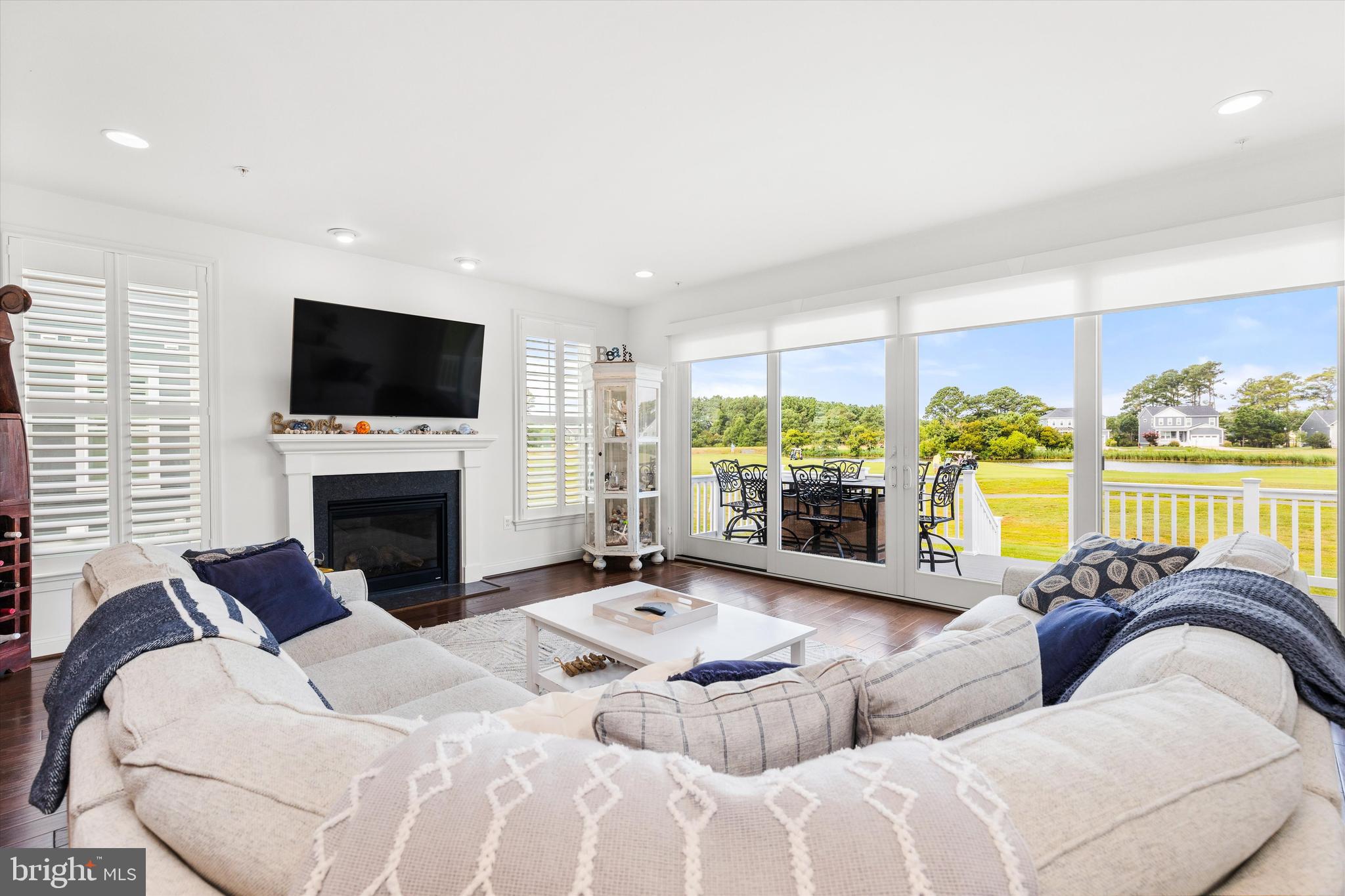 10119 Fast Colors Lane Berlin, MD 21811 - Photo 12 of 43 a bedroom with furniture a large window and a flat screen tv