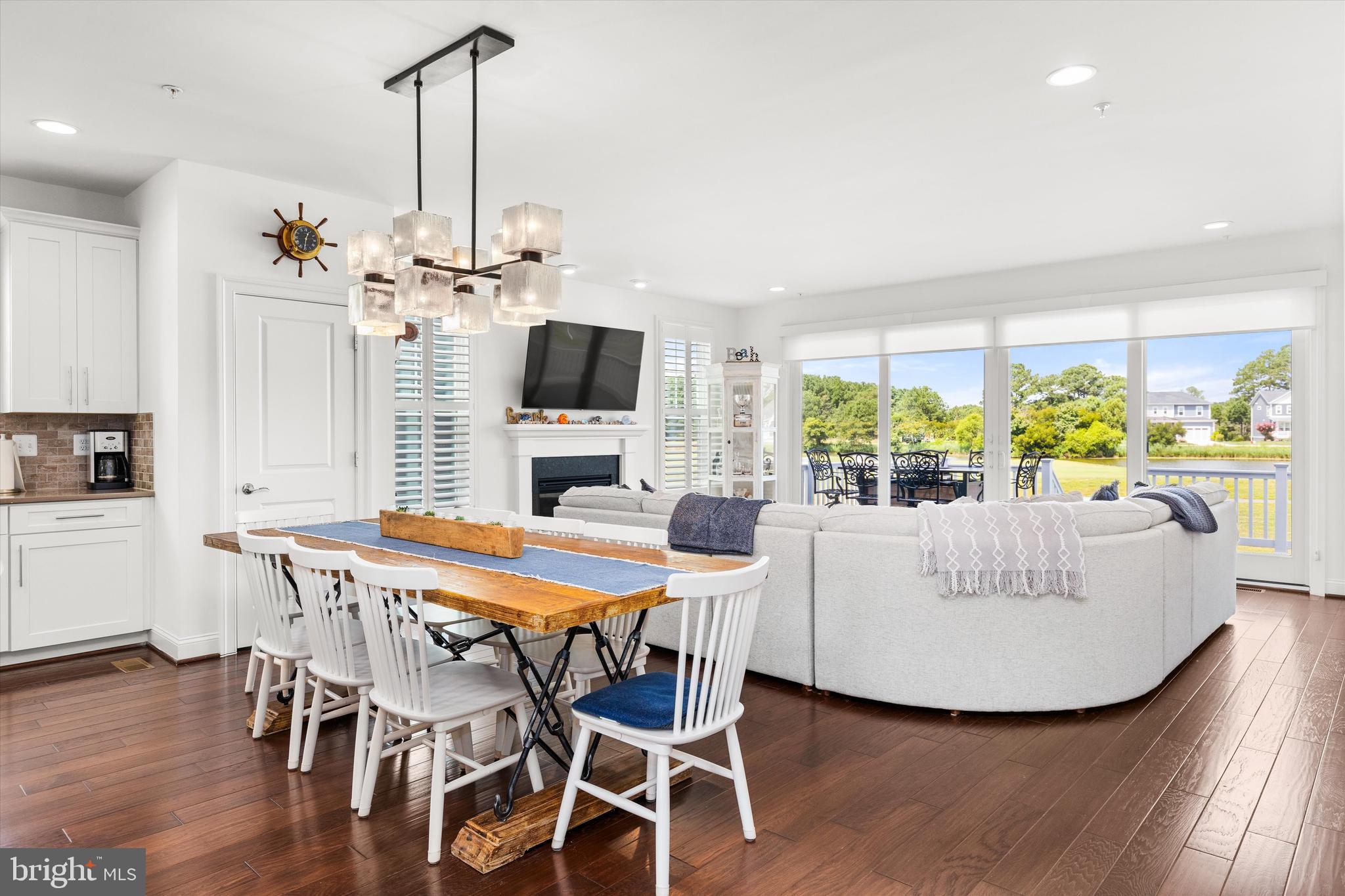 10119 Fast Colors Lane Berlin, MD 21811 - Photo 19 of 43 a living room with fireplace furniture and a chandelier