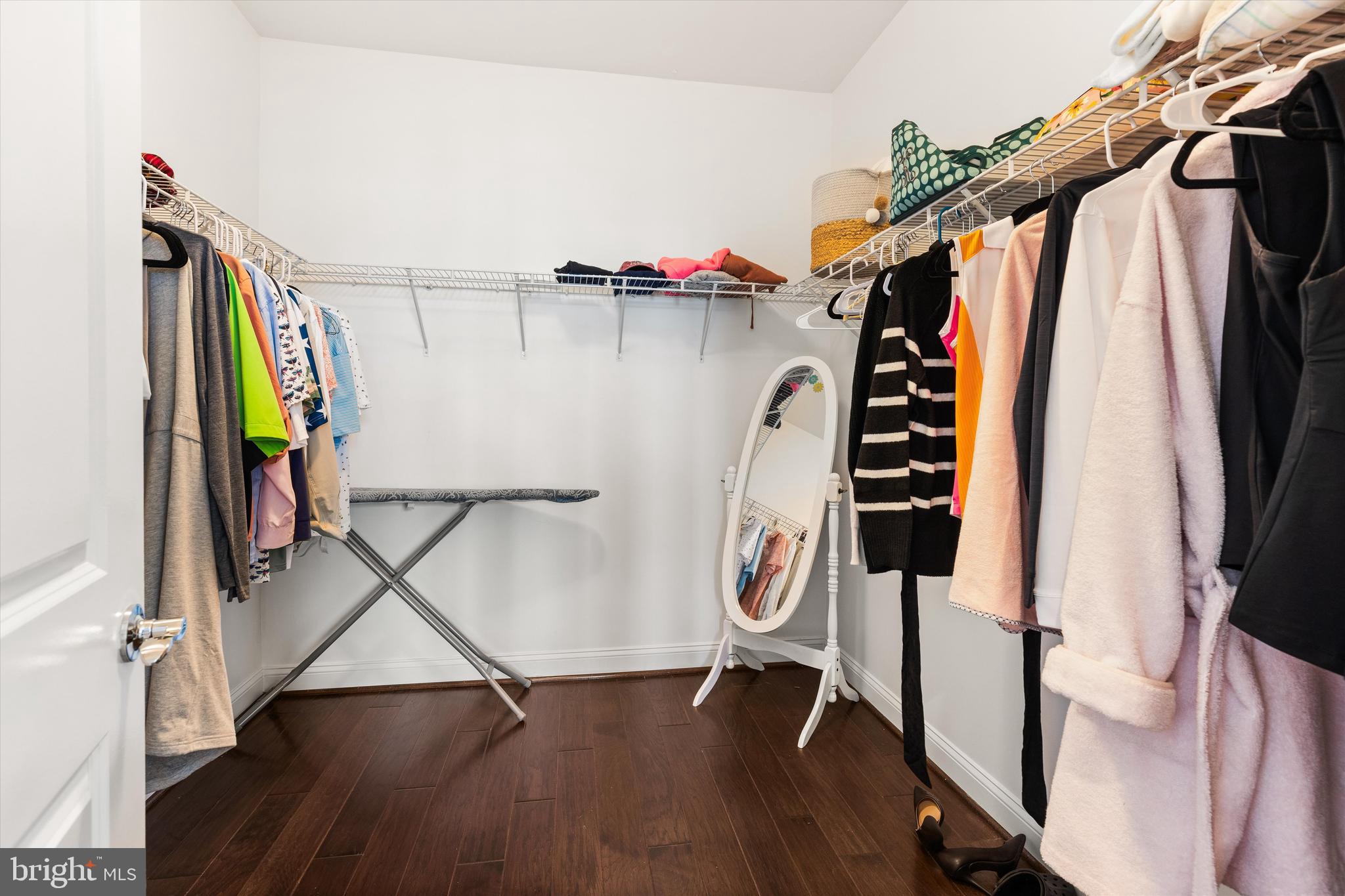 10119 Fast Colors Lane Berlin, MD 21811 - Photo 23 of 43 a view of walk in closet with clothes and shoes