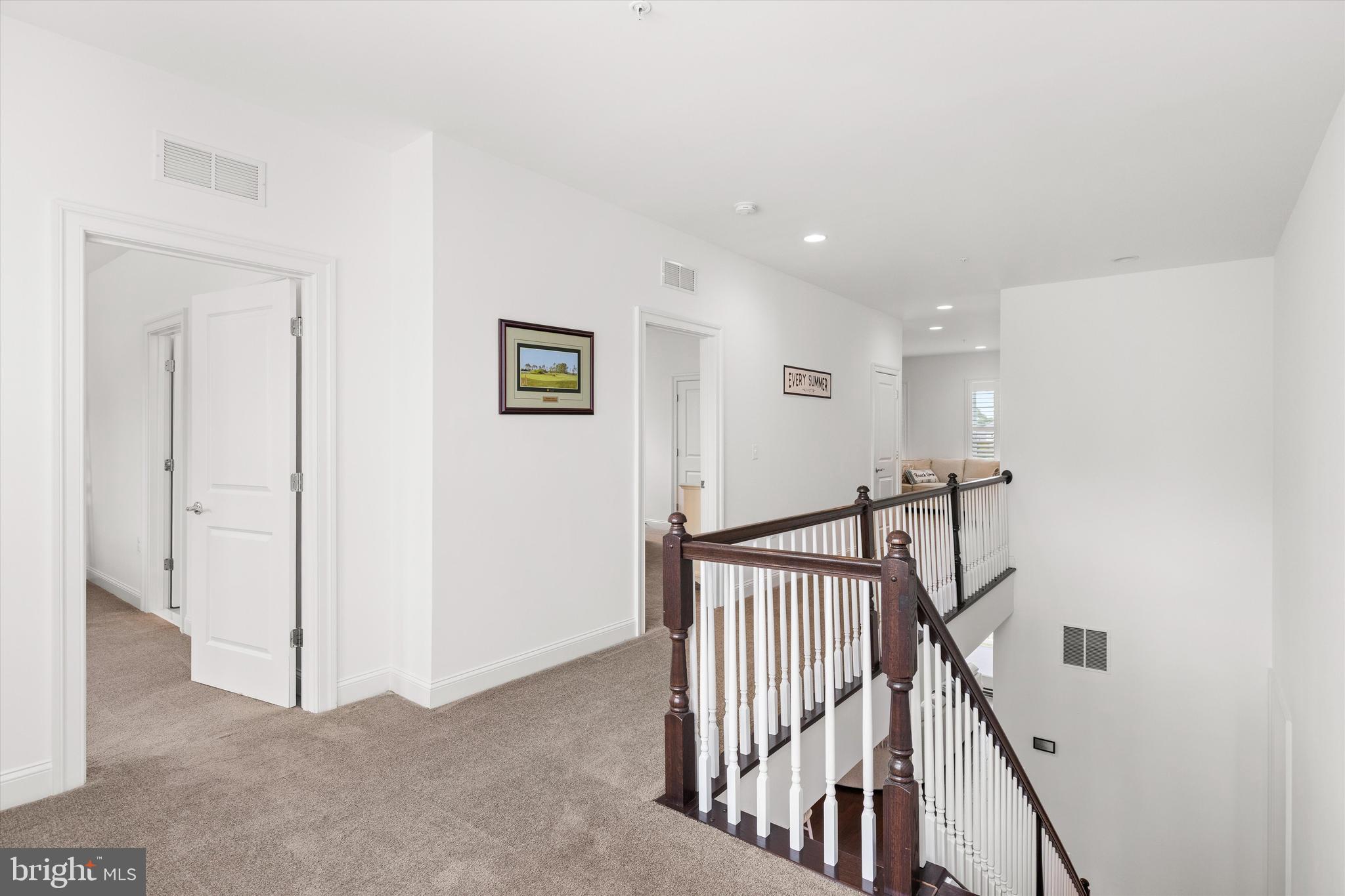 10119 Fast Colors Lane Berlin, MD 21811 - Photo 30 of 43 a view of a hallway with staircase