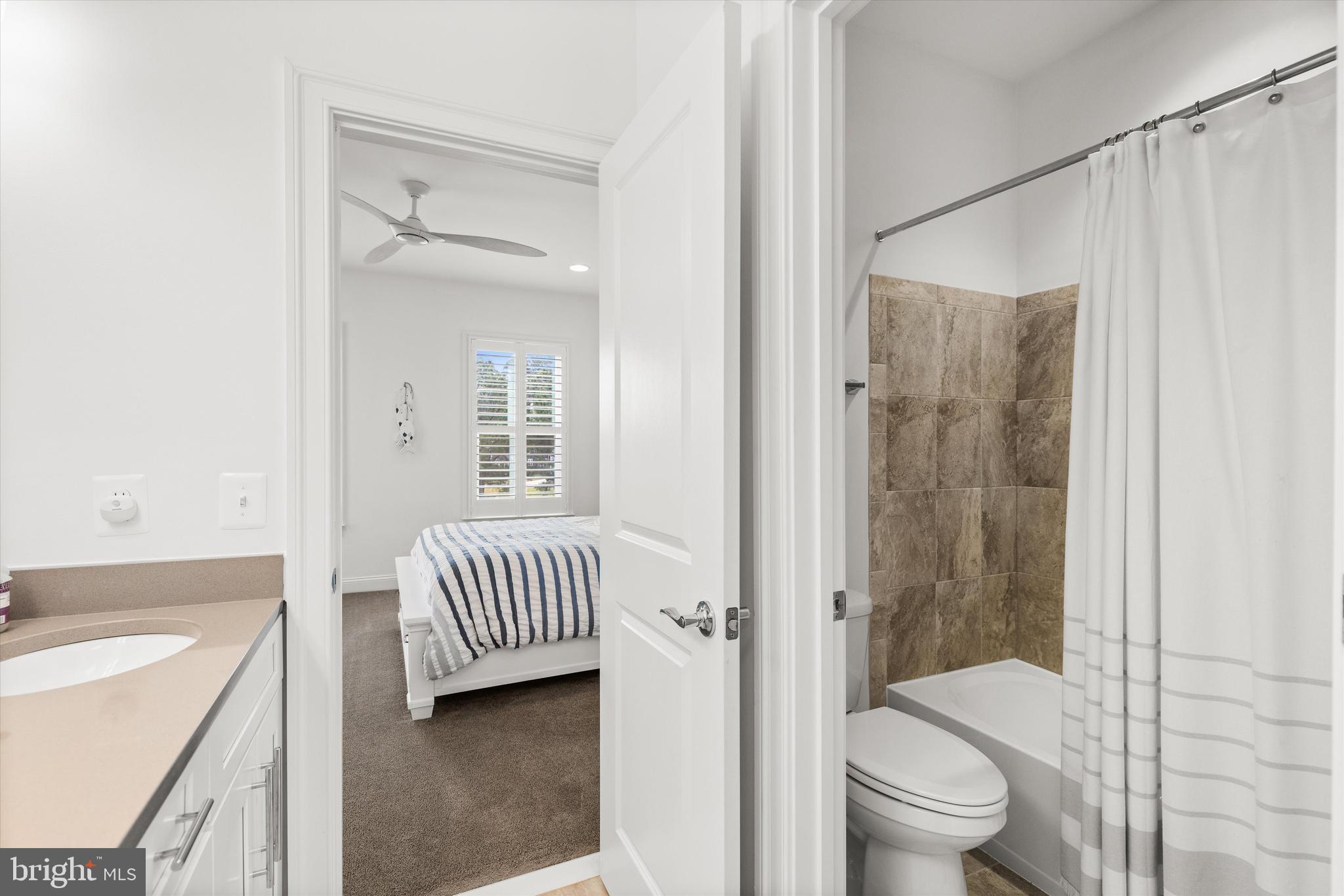 10119 Fast Colors Lane Berlin, MD 21811 - Photo 38 of 43 a bathroom with a sink toilet and shower