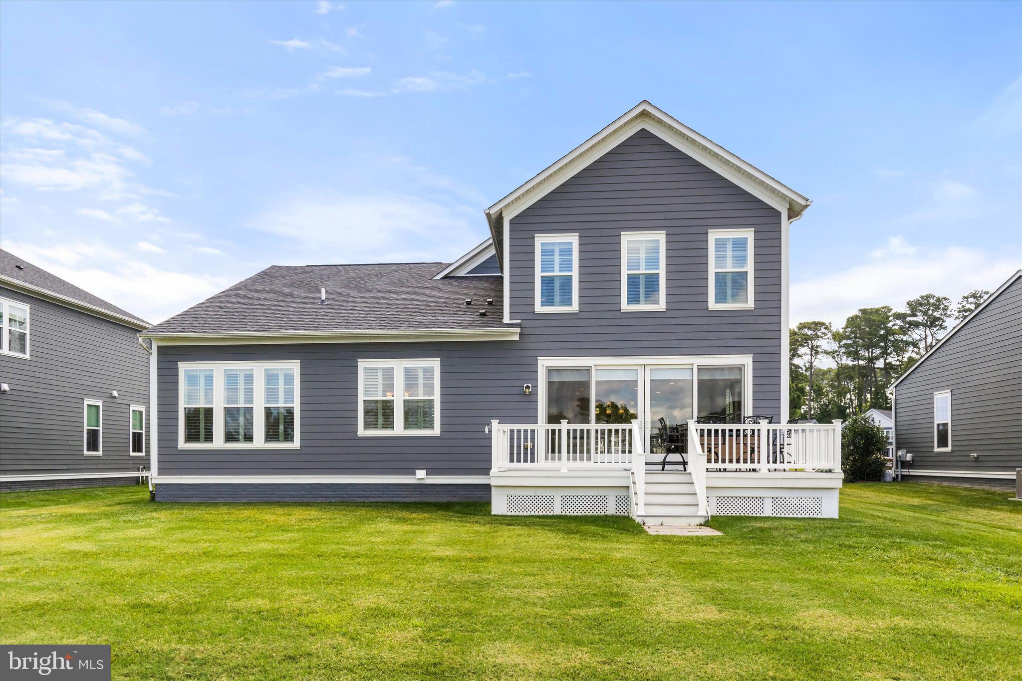 10119 Fast Colors Lane Berlin, MD 21811 - Photo 41 of 43 a front view of a house with a garden and yard