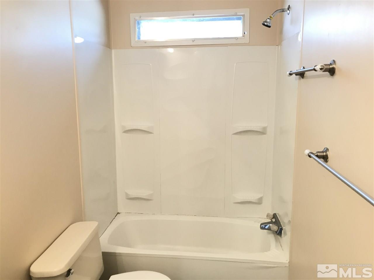 1890 Collins Circle Reno, NV 89506 - Photo 16 of 21 a bathroom with a bathtub and a shower