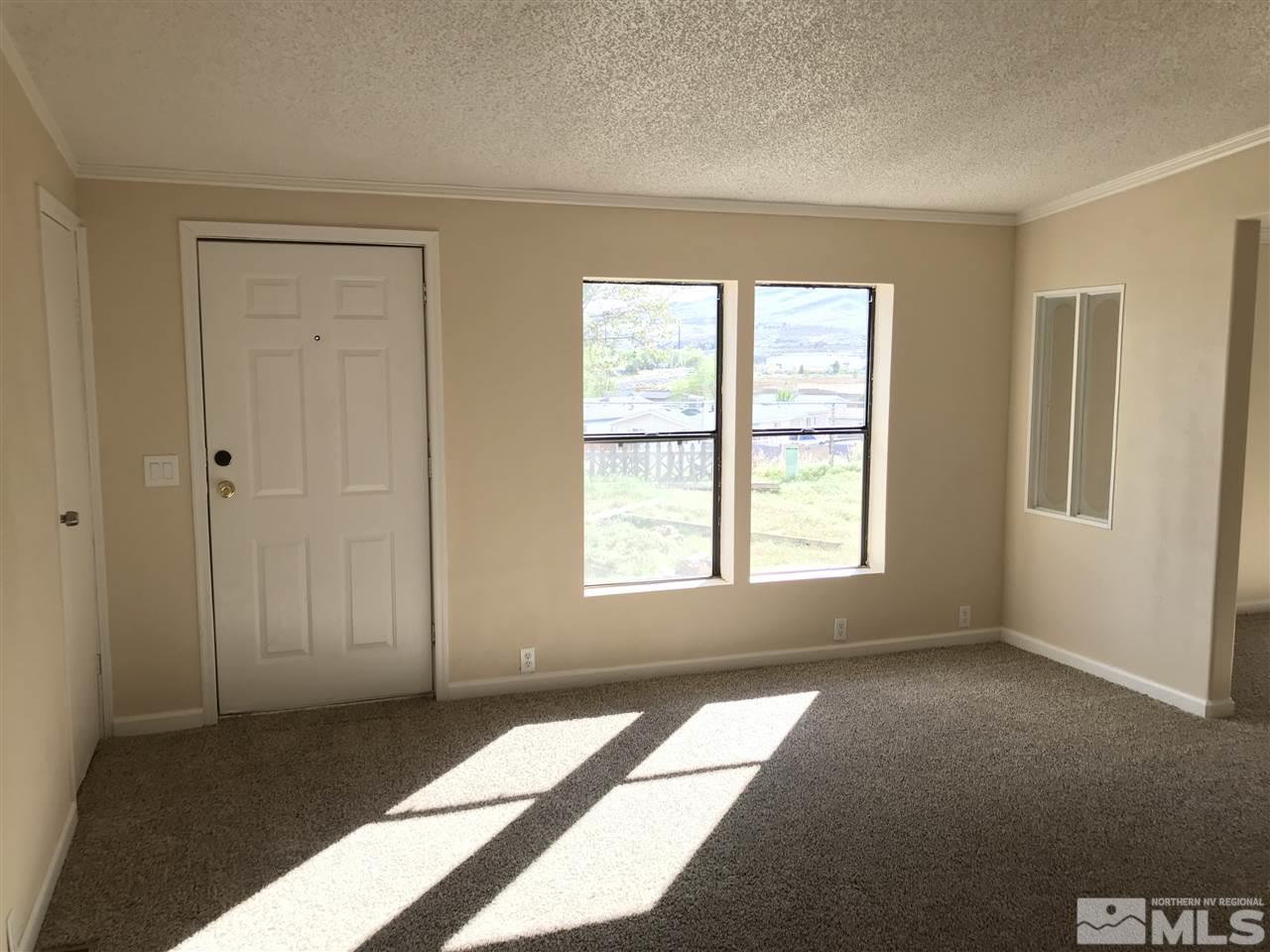 1890 Collins Circle Reno, NV 89506 - Photo 2 of 21 a view of an empty room with a window