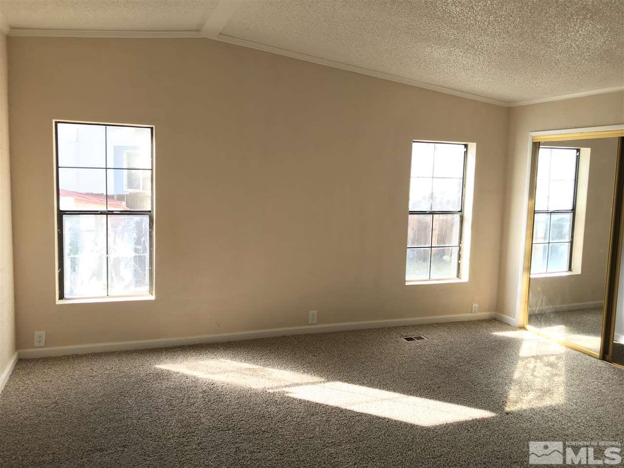 1890 Collins Circle Reno, NV 89506 - Photo 7 of 21 an empty room with a empty space and windows