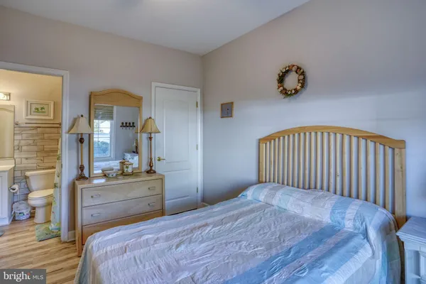 a bedroom with a bed and a table in it