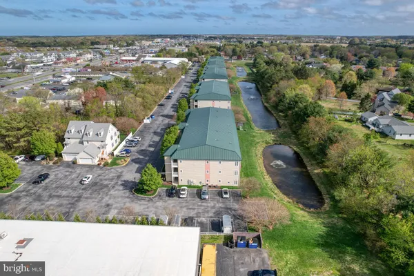 an aerial view of a house with yard swimming pool and outdoor seating