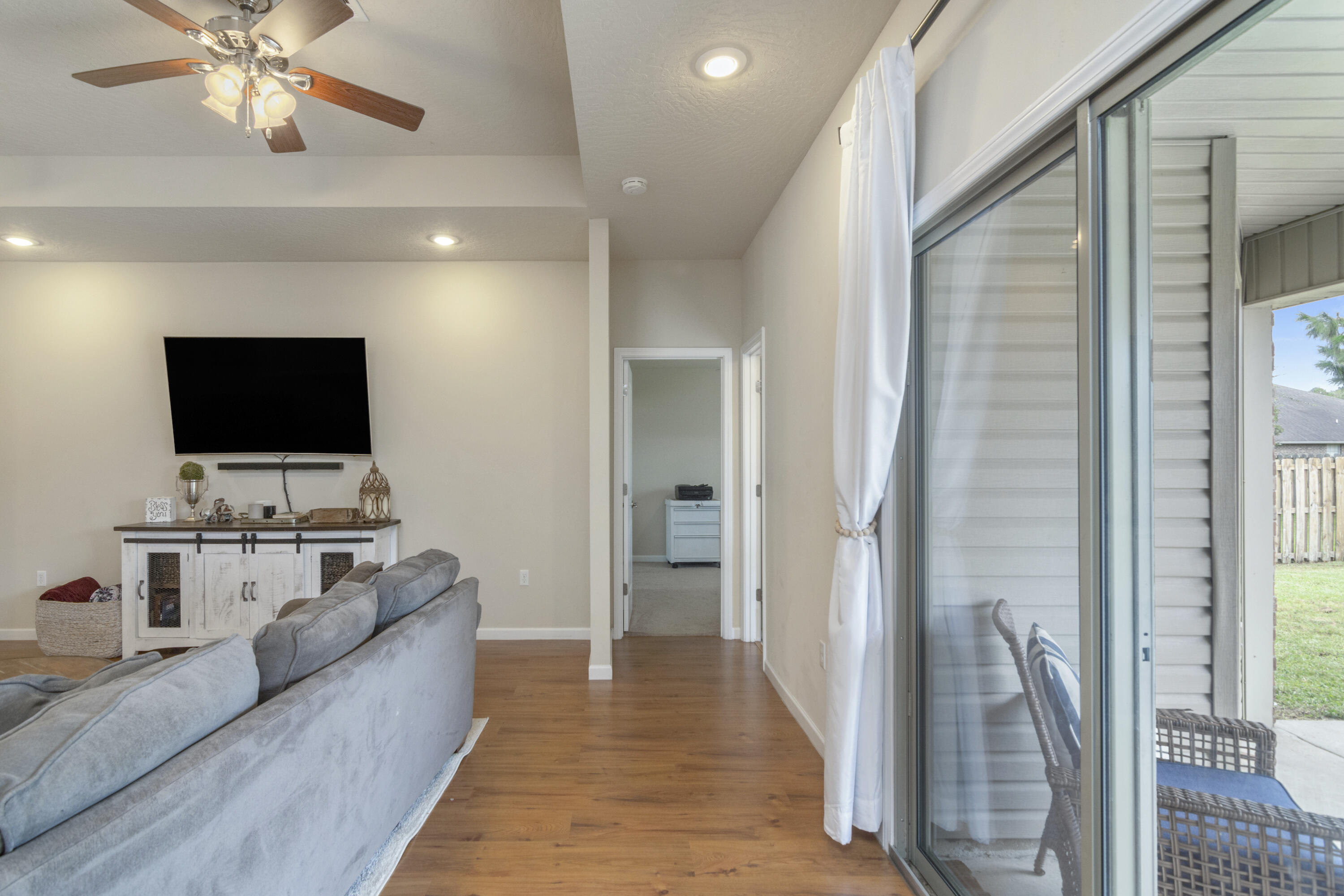 5265 Moore Loop Crestview, FL 32536 - Photo 12 of 43 a living room with furniture and a flat screen tv