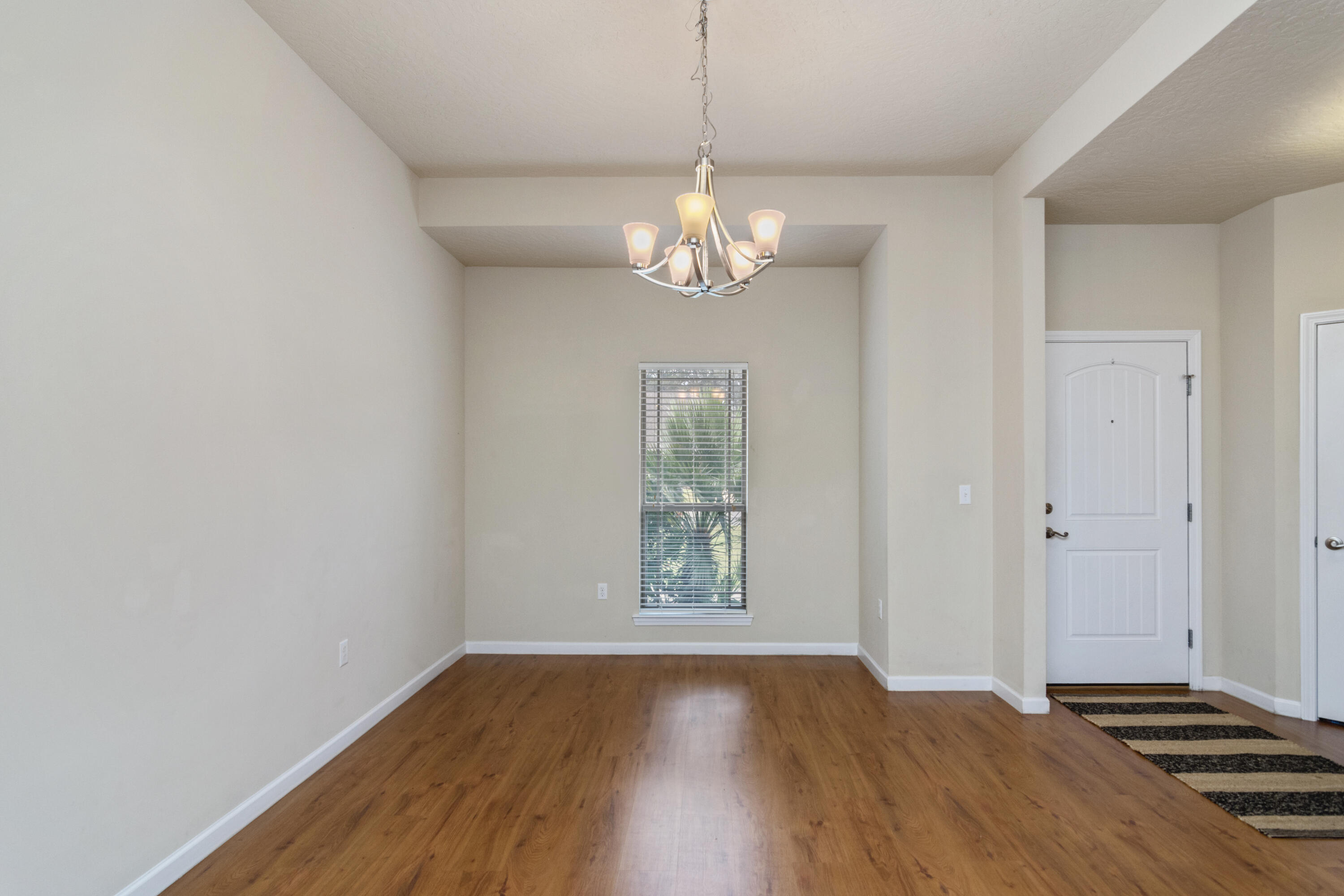 5265 Moore Loop Crestview, FL 32536 - Photo 15 of 43 a view of empty room with wooden floor and window