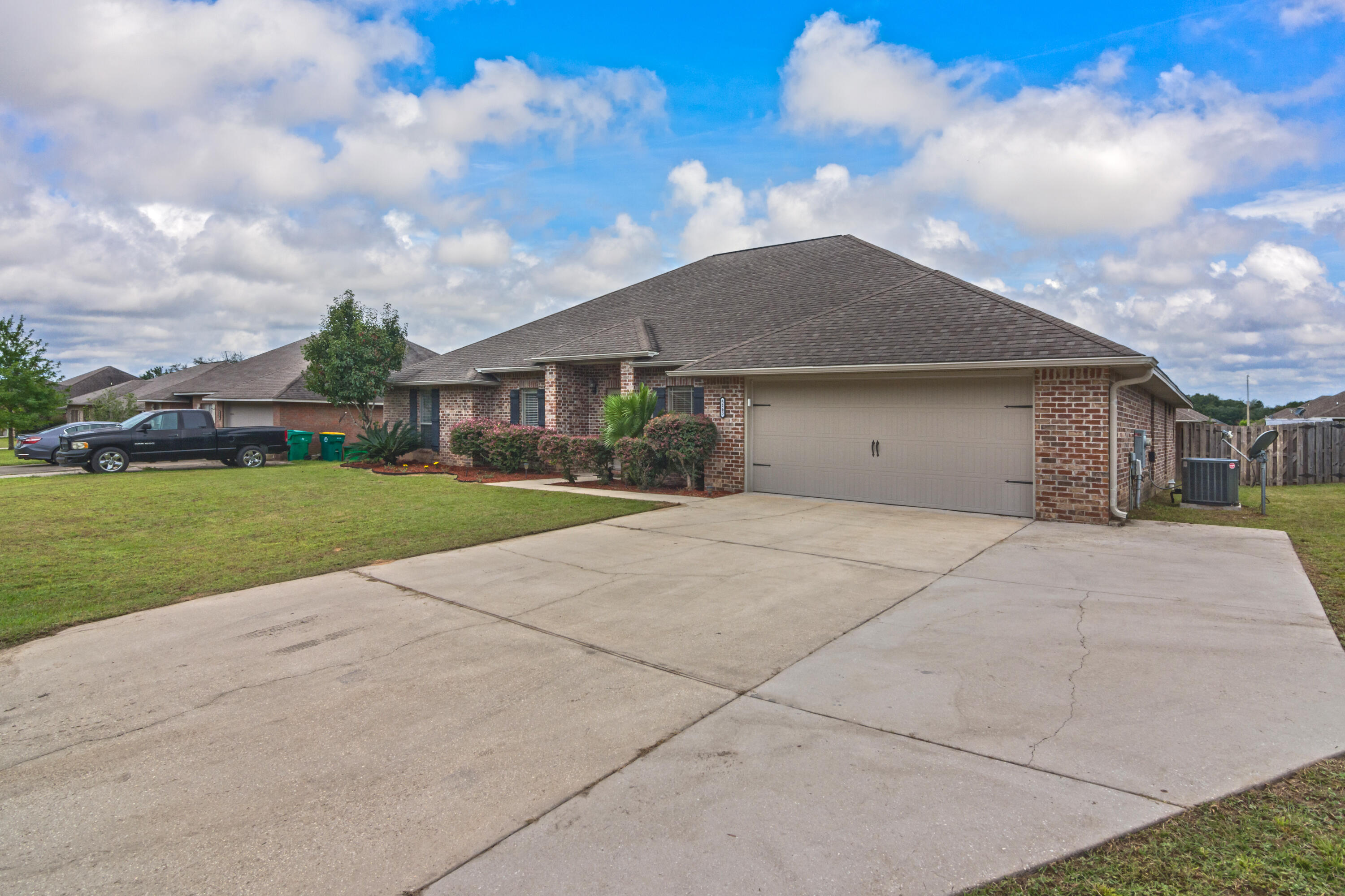 5265 Moore Loop Crestview, FL 32536 - Photo 3 of 43 a view of garage and yard