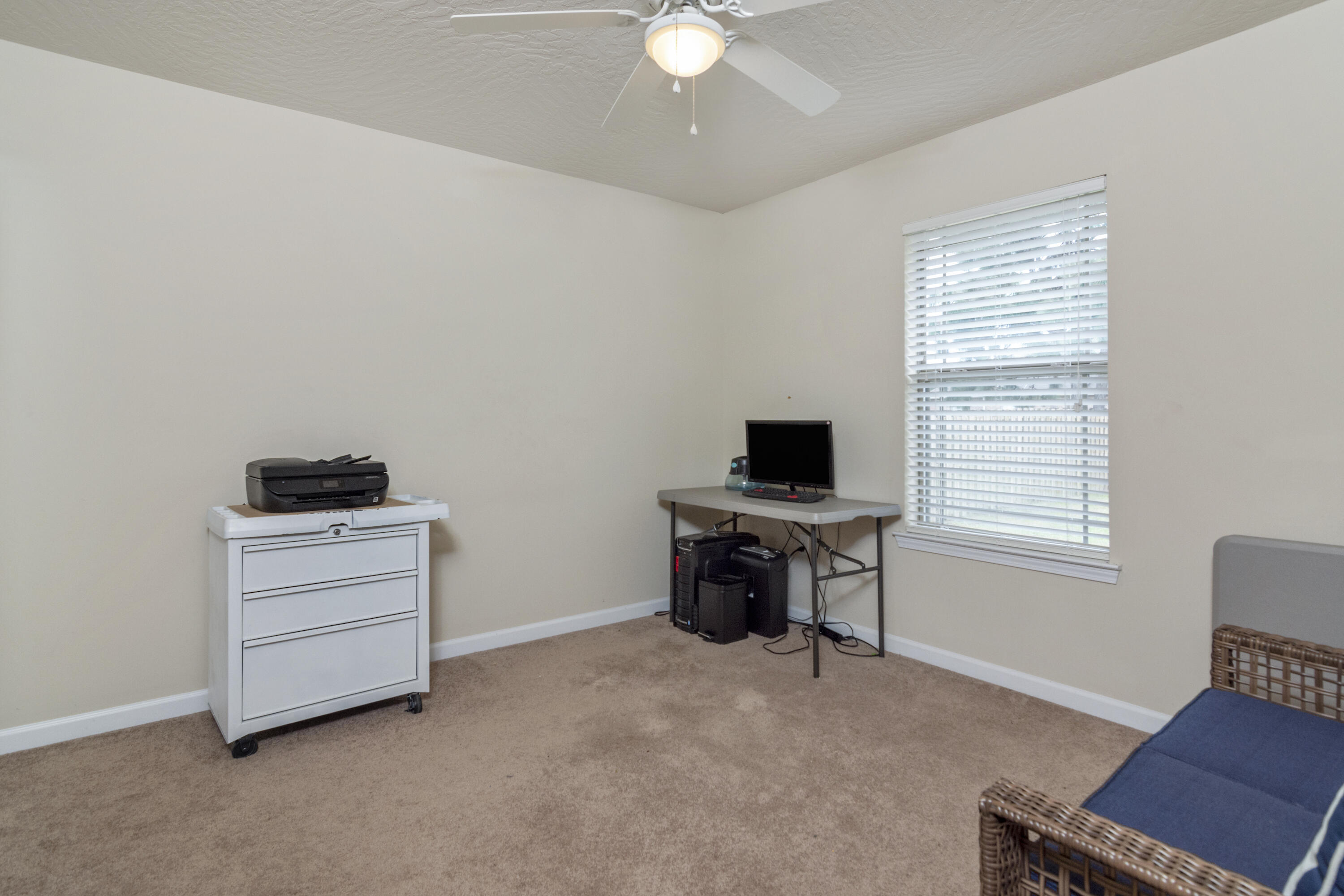5265 Moore Loop Crestview, FL 32536 - Photo 24 of 43 a room with furniture and a flat screen tv
