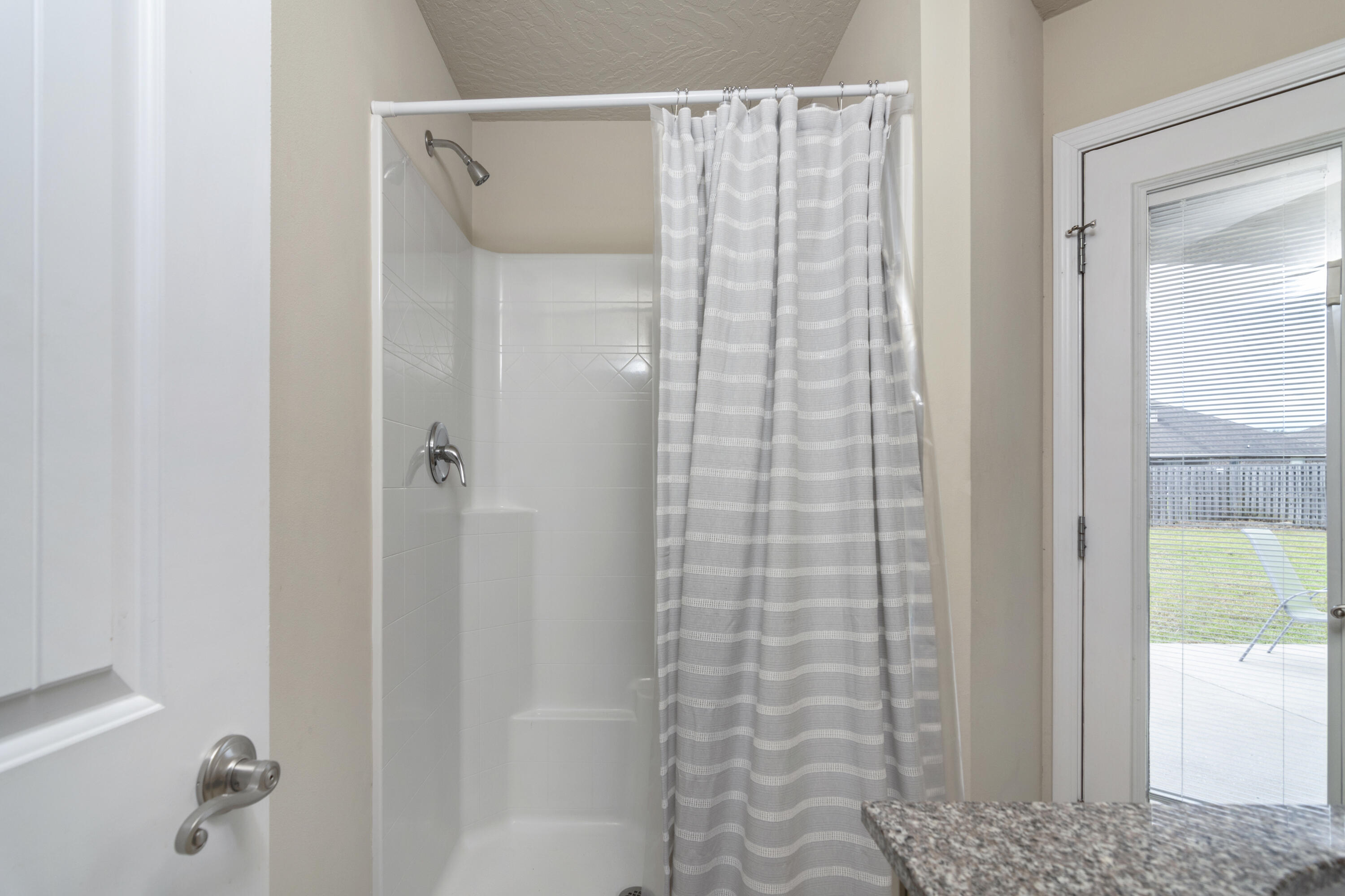 5265 Moore Loop Crestview, FL 32536 - Photo 26 of 43 a bathroom with a shower