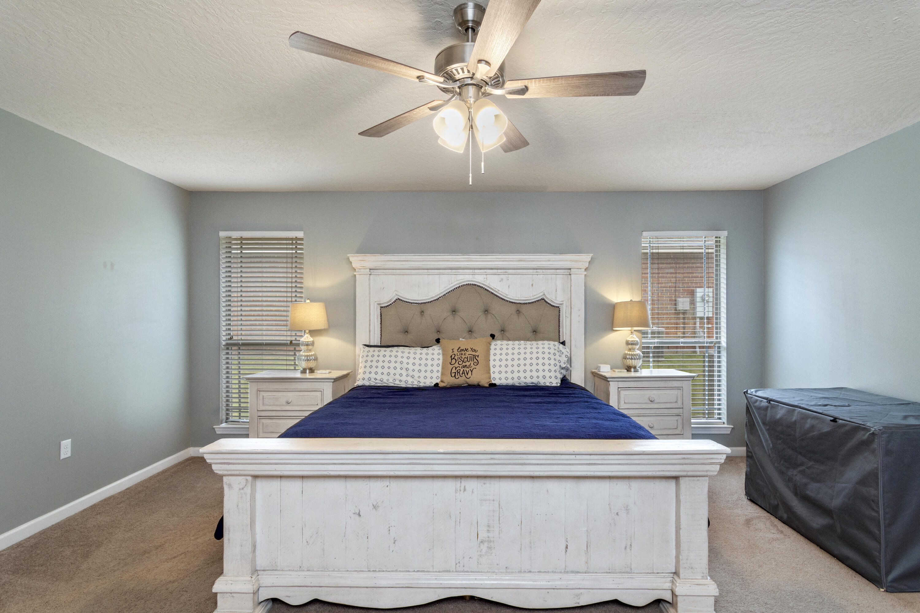 5265 Moore Loop Crestview, FL 32536 - Photo 29 of 43 a living room with a couch and a chandelier