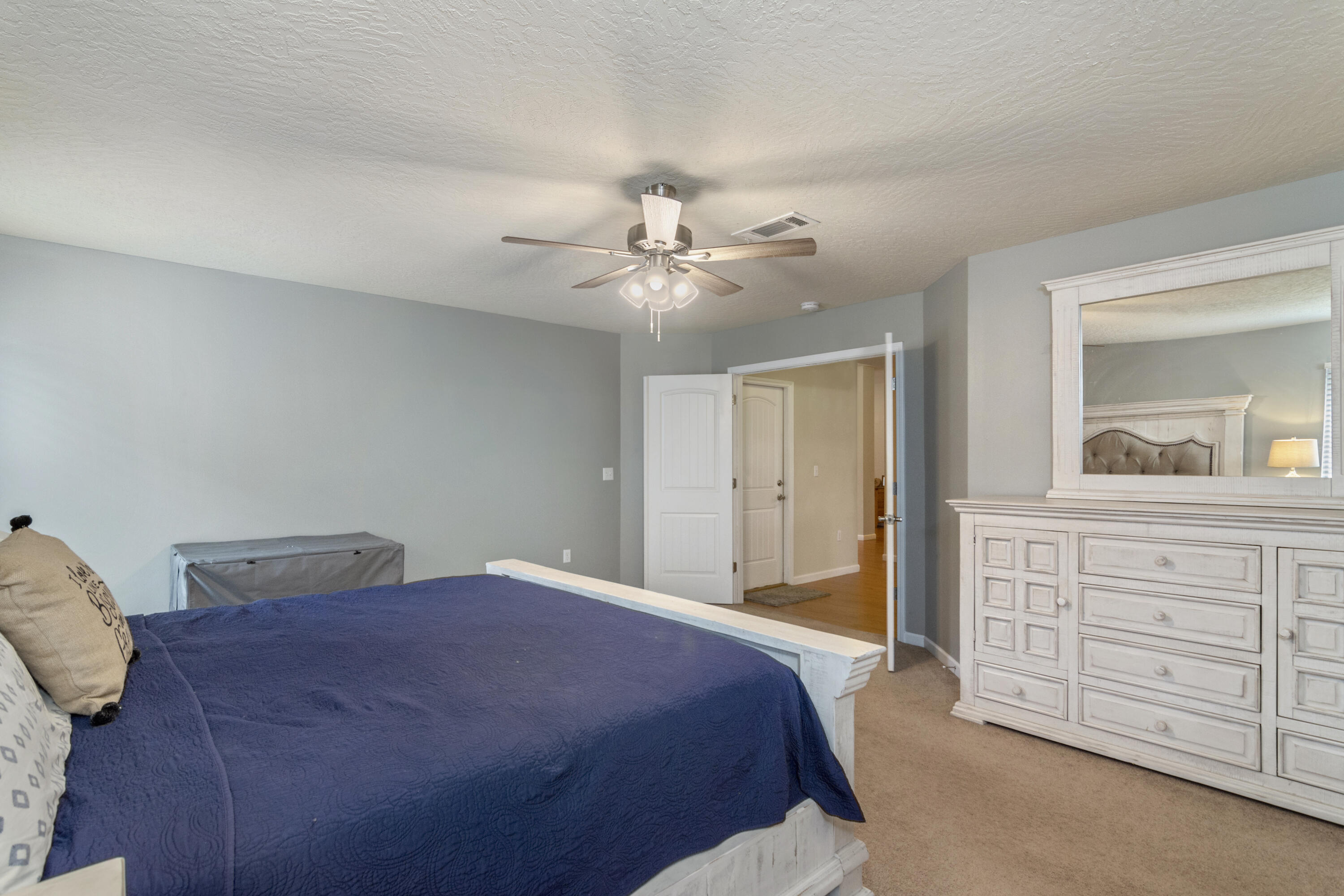 5265 Moore Loop Crestview, FL 32536 - Photo 30 of 43 a bedroom with a bed and a dresser