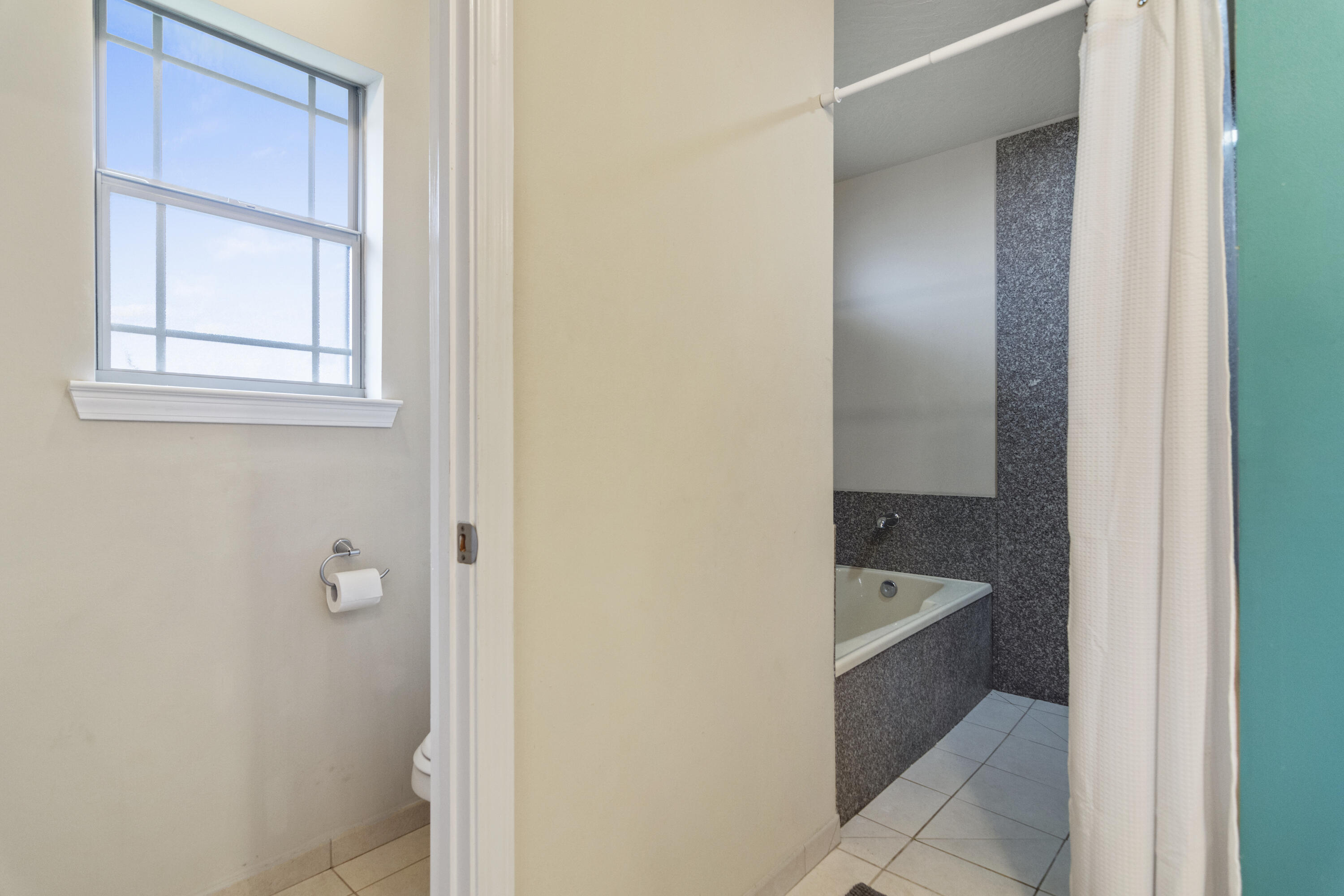 5265 Moore Loop Crestview, FL 32536 - Photo 33 of 43 a bathroom with a tub shower and sink