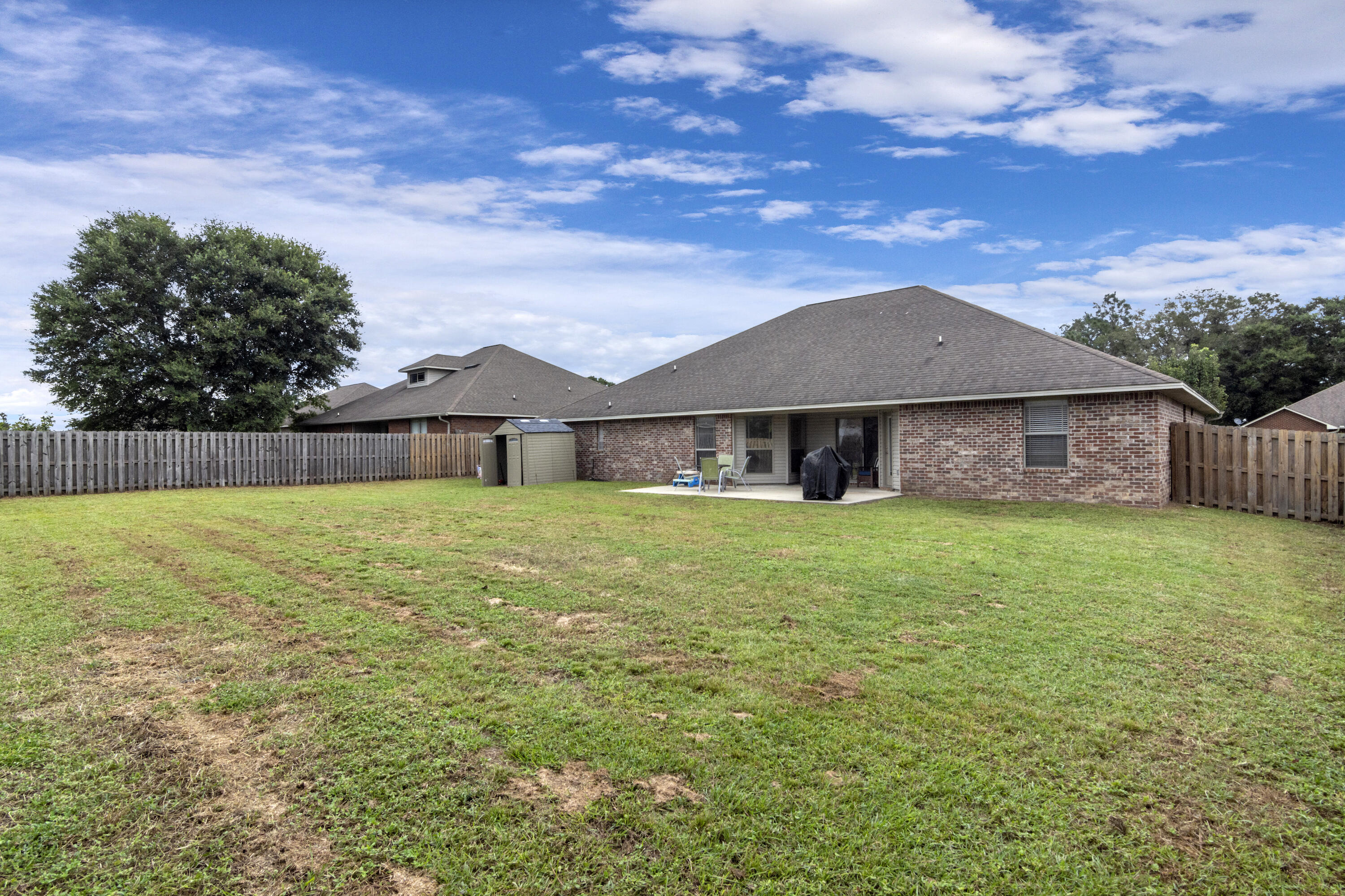 5265 Moore Loop Crestview, FL 32536 - Photo 40 of 43 a front view of a house with a garden