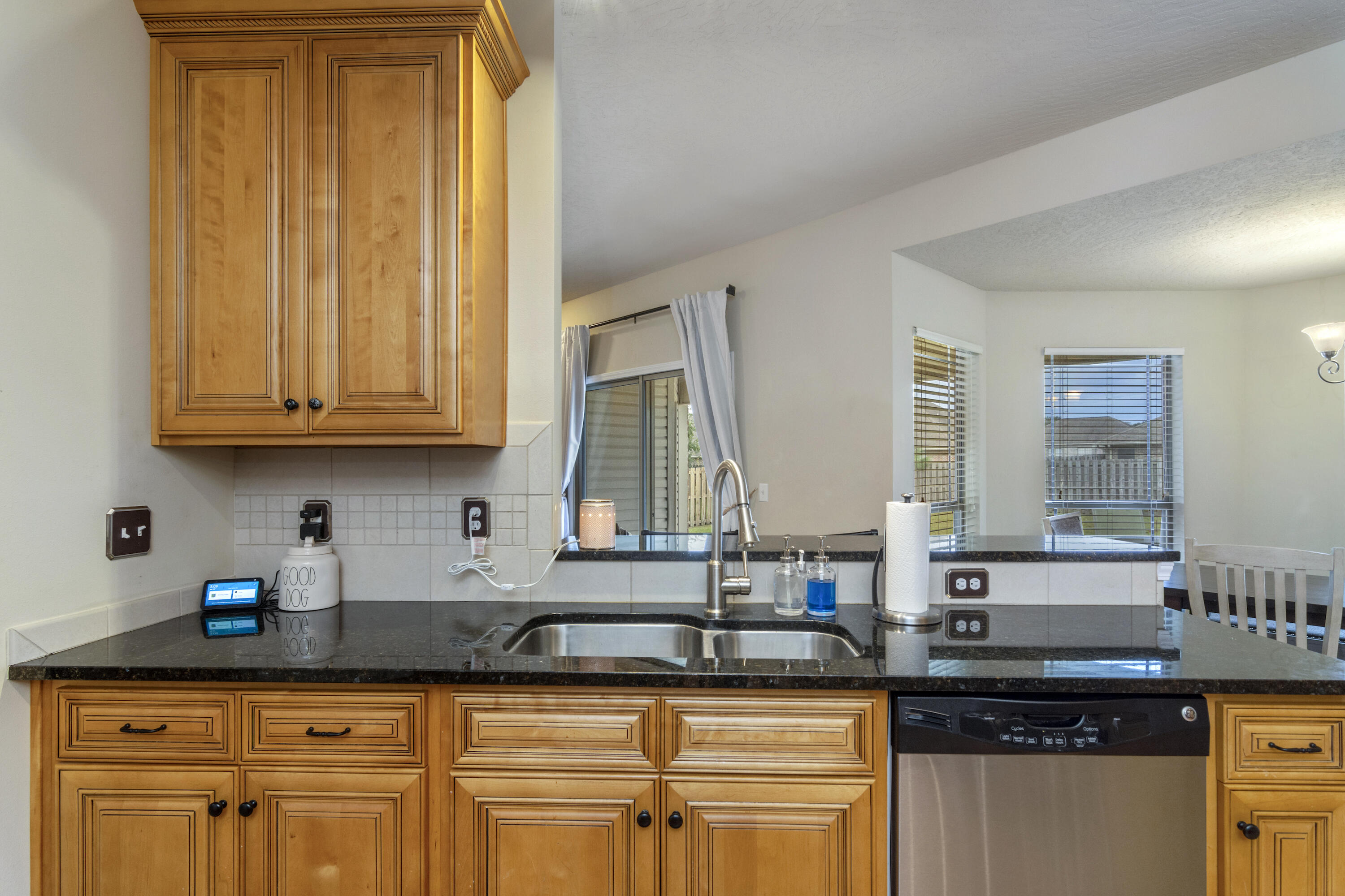 5265 Moore Loop Crestview, FL 32536 - Photo 5 of 43 a kitchen with granite countertop a sink a stove and cabinets