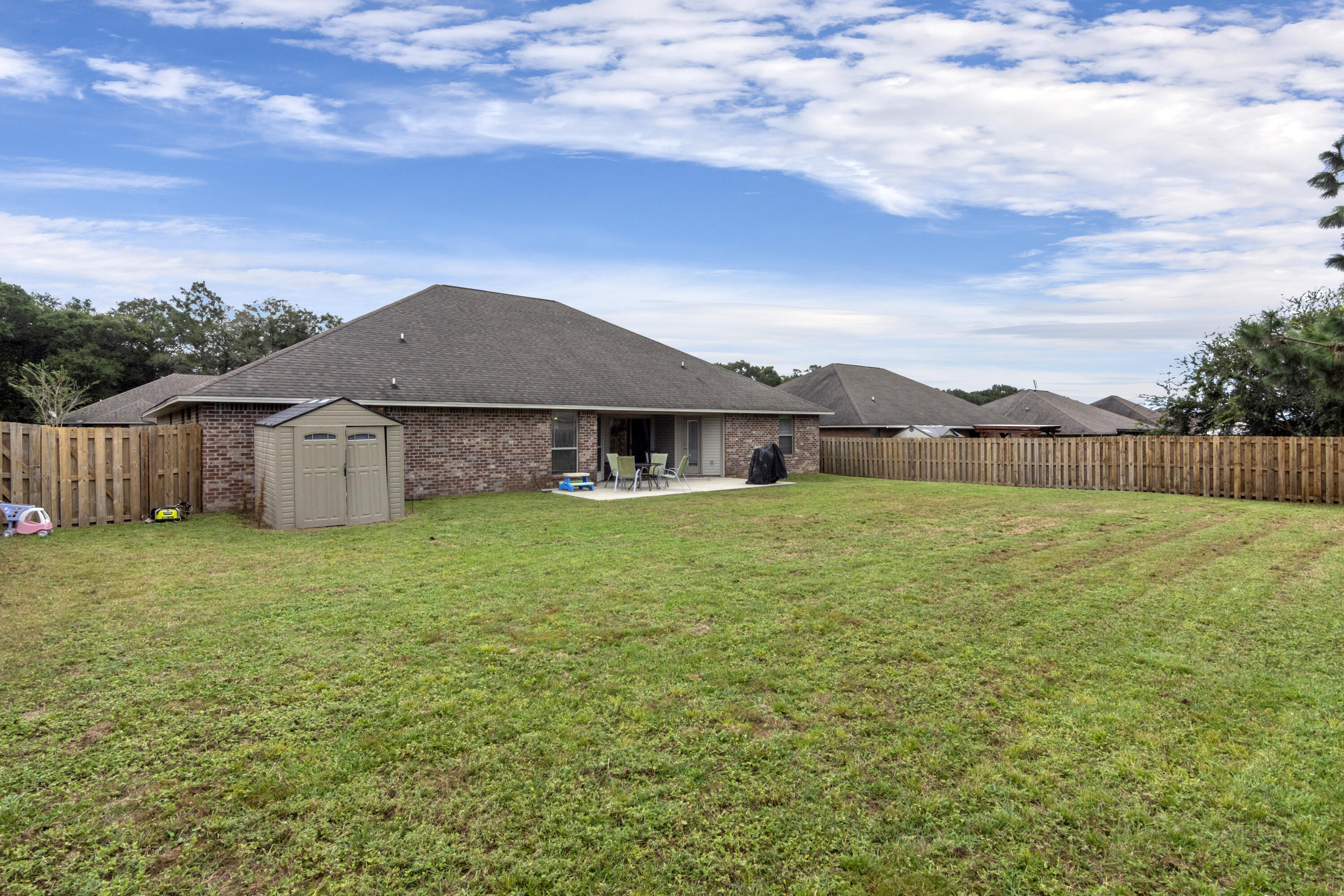 5265 Moore Loop Crestview, FL 32536 - Photo 41 of 43 a house with huge green field in front of it