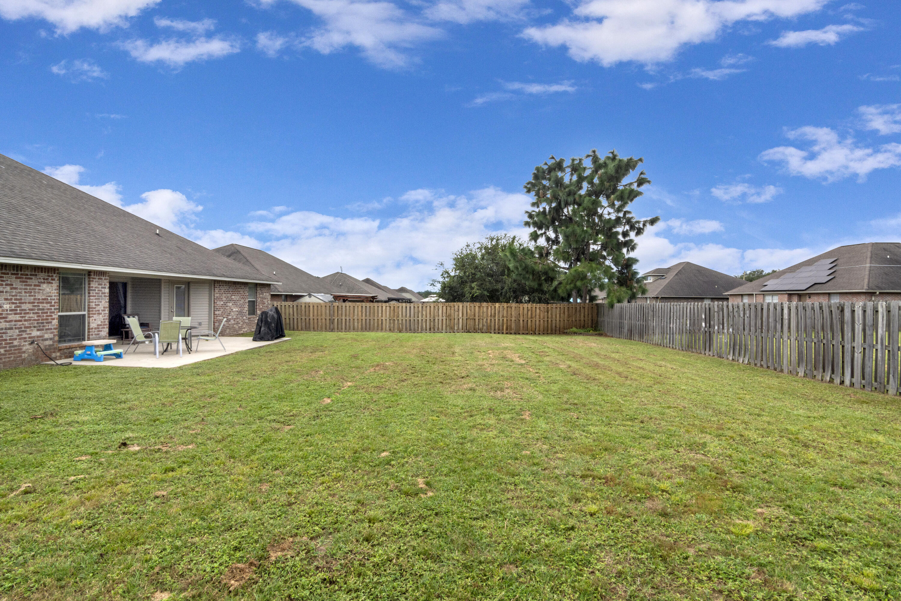 5265 Moore Loop Crestview, FL 32536 - Photo 42 of 43 a swimming pool with wooden fence