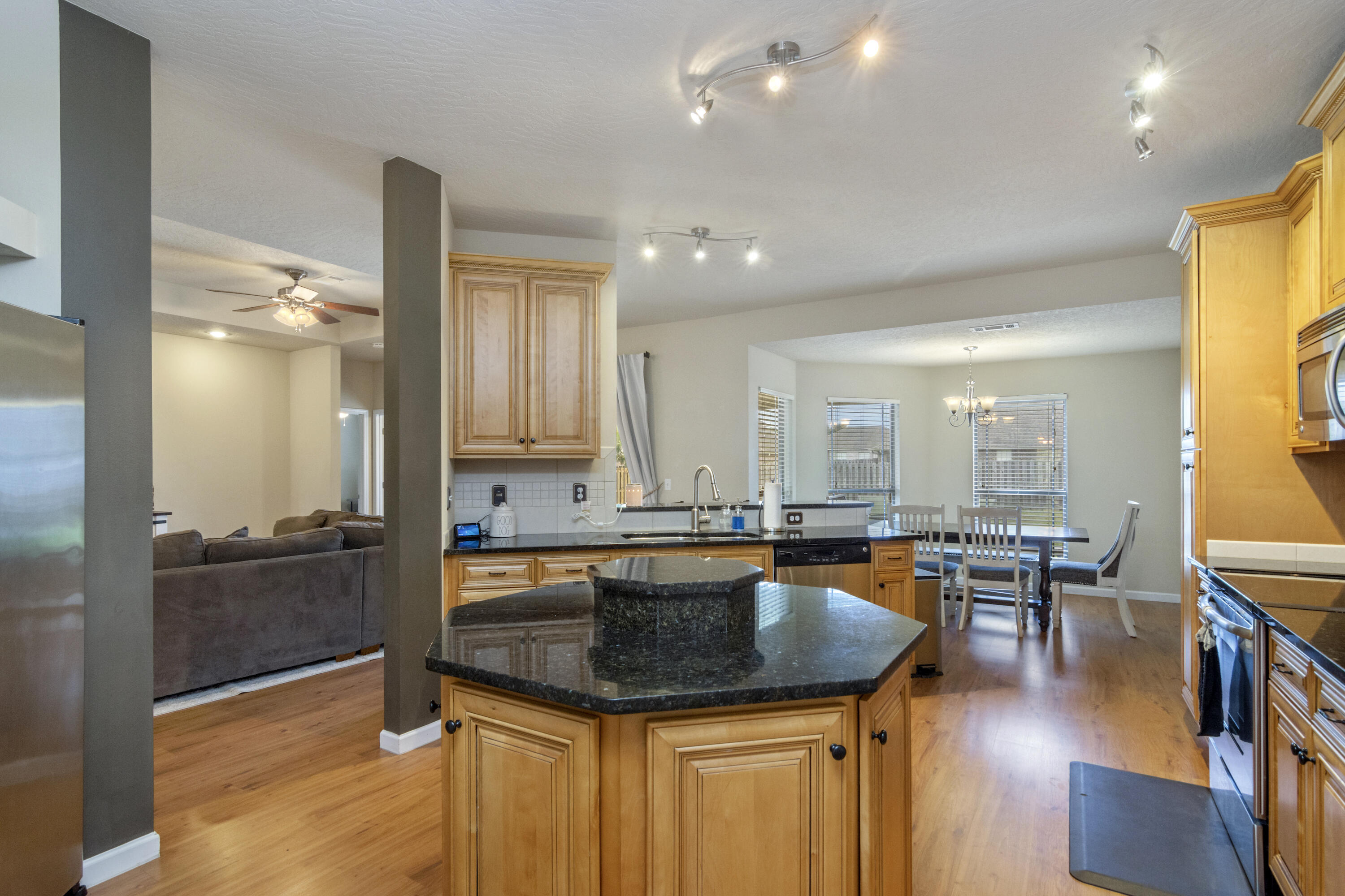 5265 Moore Loop Crestview, FL 32536 - Photo 6 of 43 a kitchen with granite countertop lots of counter top space and stainless steel appliances