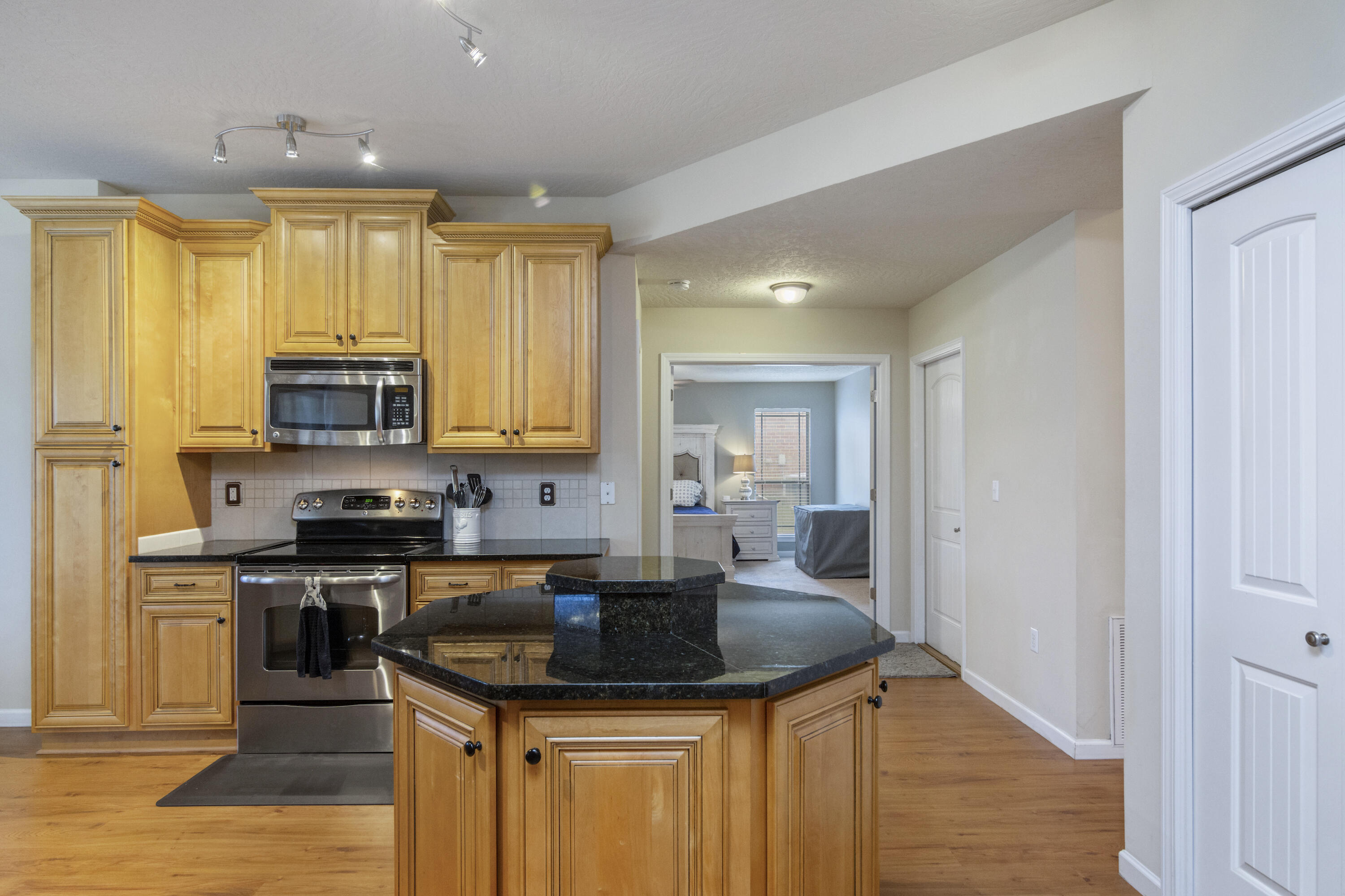 5265 Moore Loop Crestview, FL 32536 - Photo 9 of 43 a kitchen with stainless steel appliances granite countertop a sink stove and cabinets