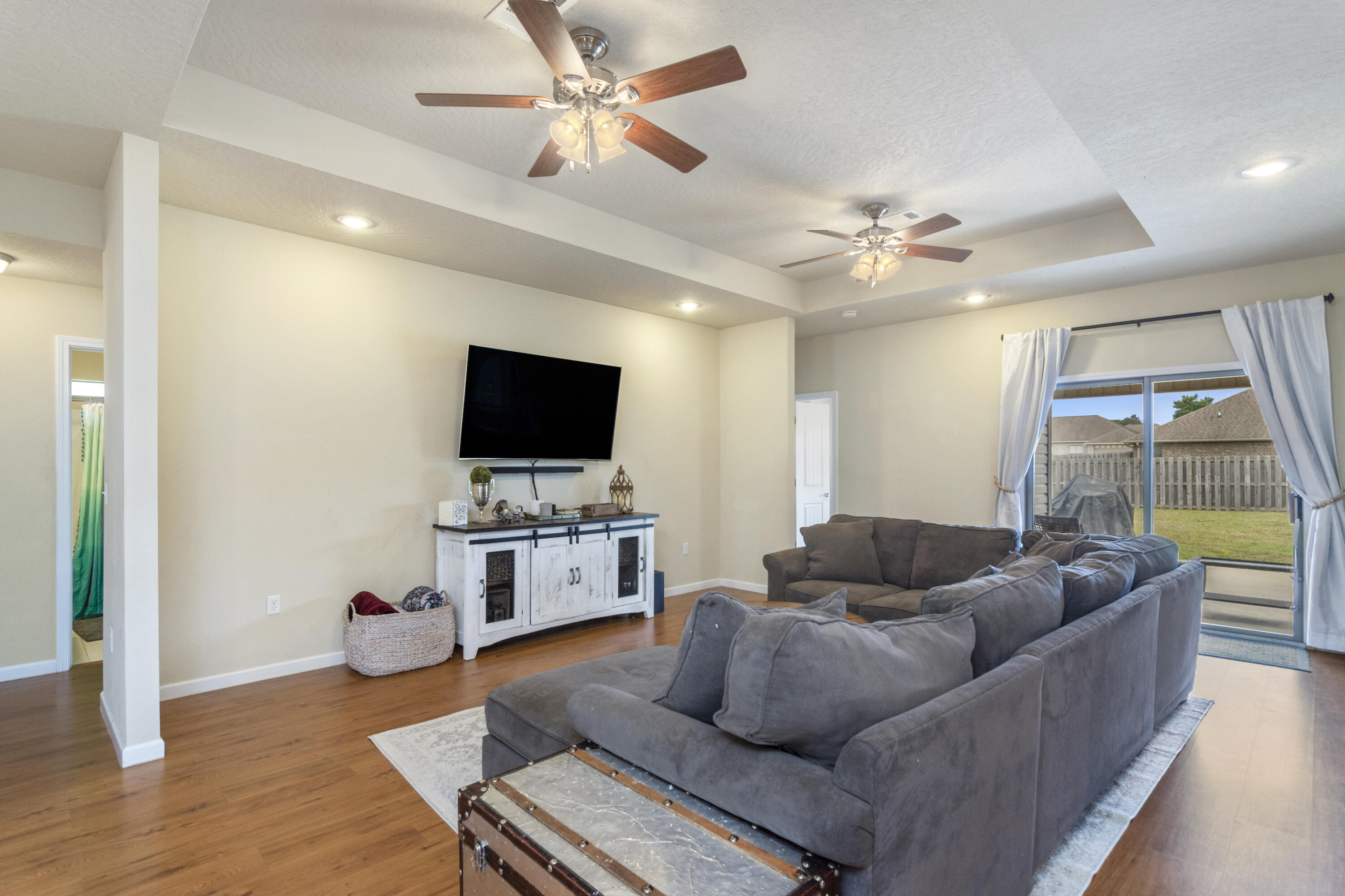 5265 Moore Loop Crestview, FL 32536 - Photo 10 of 43 a living room with furniture and a flat screen tv