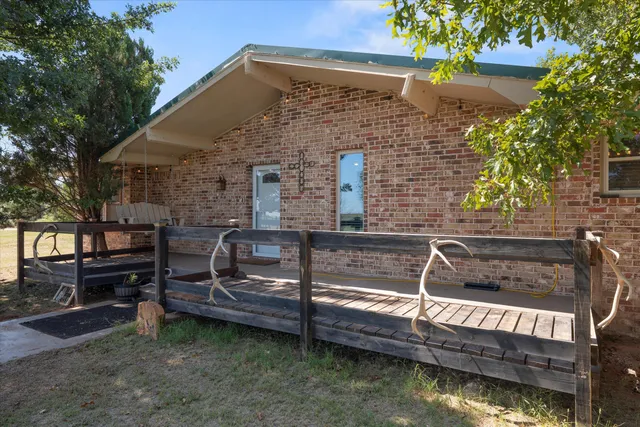 a view of a chairs and table in the roof deck