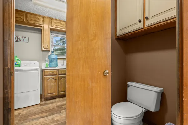 a white toilet sitting next to a bathroom sink