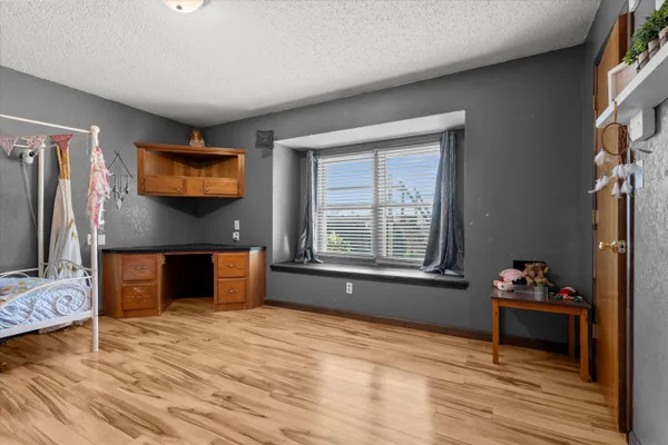 a view of a livingroom with furniture and an empty room
