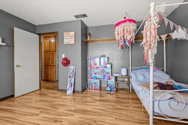 a view of a room with wooden floor and stairs
