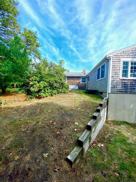 10 Sandpiper Road Harwich, MA 02645 - Photo 40 of 41 a view of a house with yard and a tree