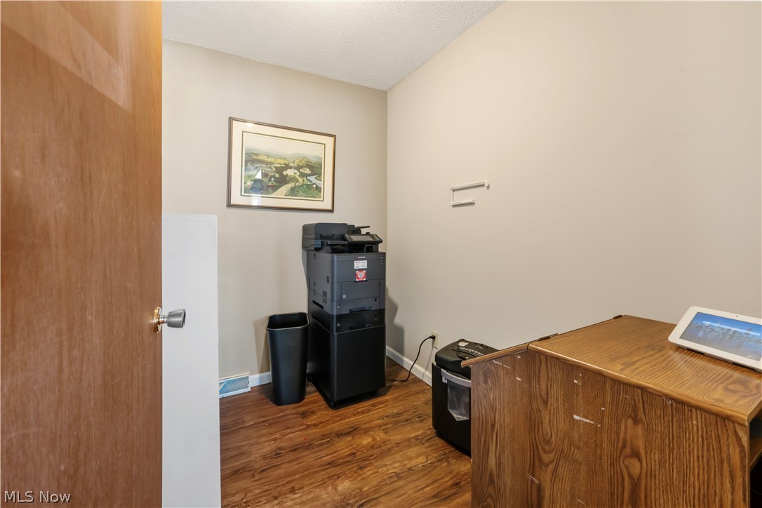 4001 South Cleveland Massillon Road Barberton, OH 44203 - Photo 8 of 25 Office featuring dark wood-style flooring and a textured ceiling