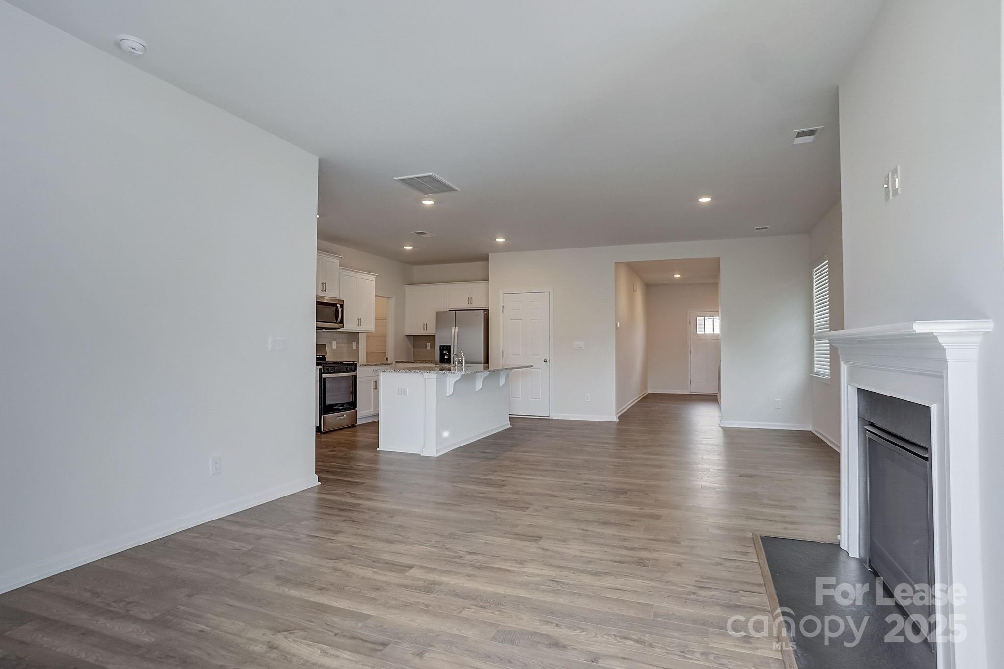 142 Old Home Road Statesville, NC 28677 - Photo 11 of 23 a view of kitchen and hall with wooden floor