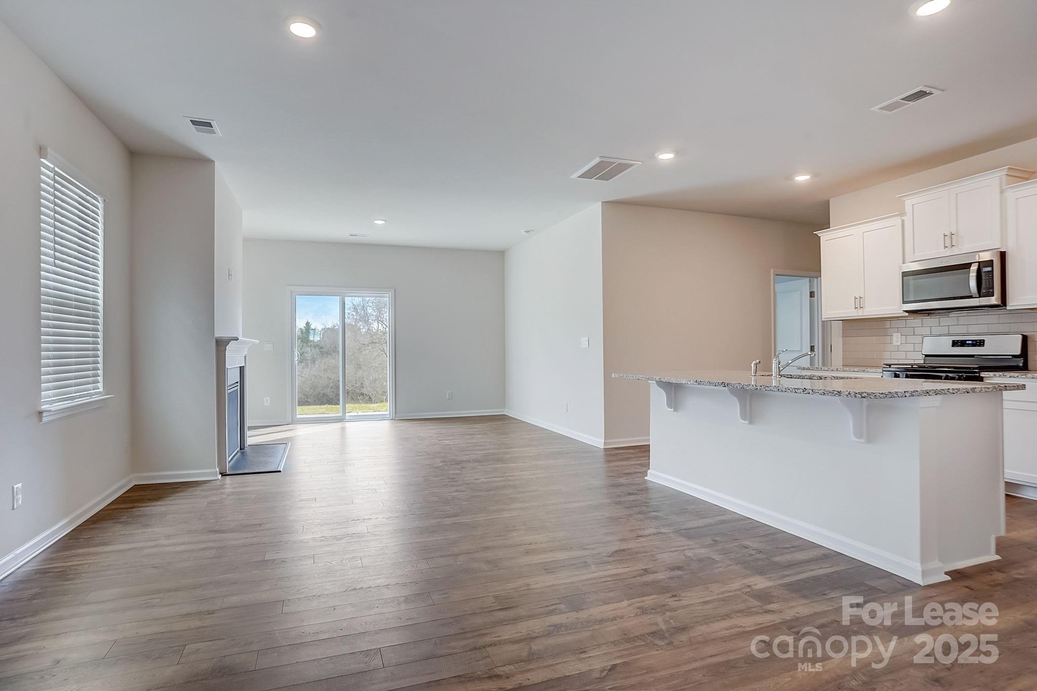 142 Old Home Road Statesville, NC 28677 - Photo 3 of 23 a view of kitchen with sink and wooden floor