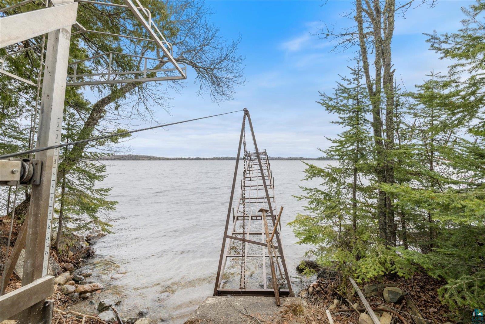 2014 West Frazer Bay Road Cook, MN 55723 - Photo 21 of 26 Waterfront property featuring a private boat lift and an extended dock structure