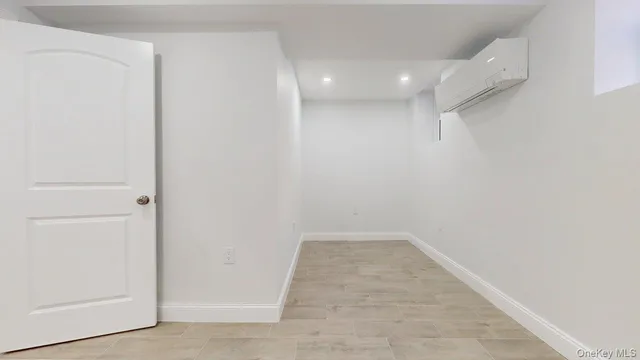 a view of walk in closet with wooden floor