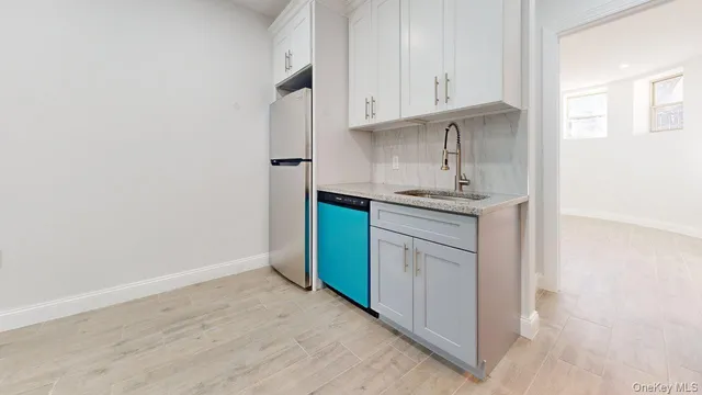 a kitchen with a sink and cabinets