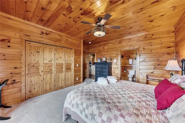 a bed room with a bed and a chair