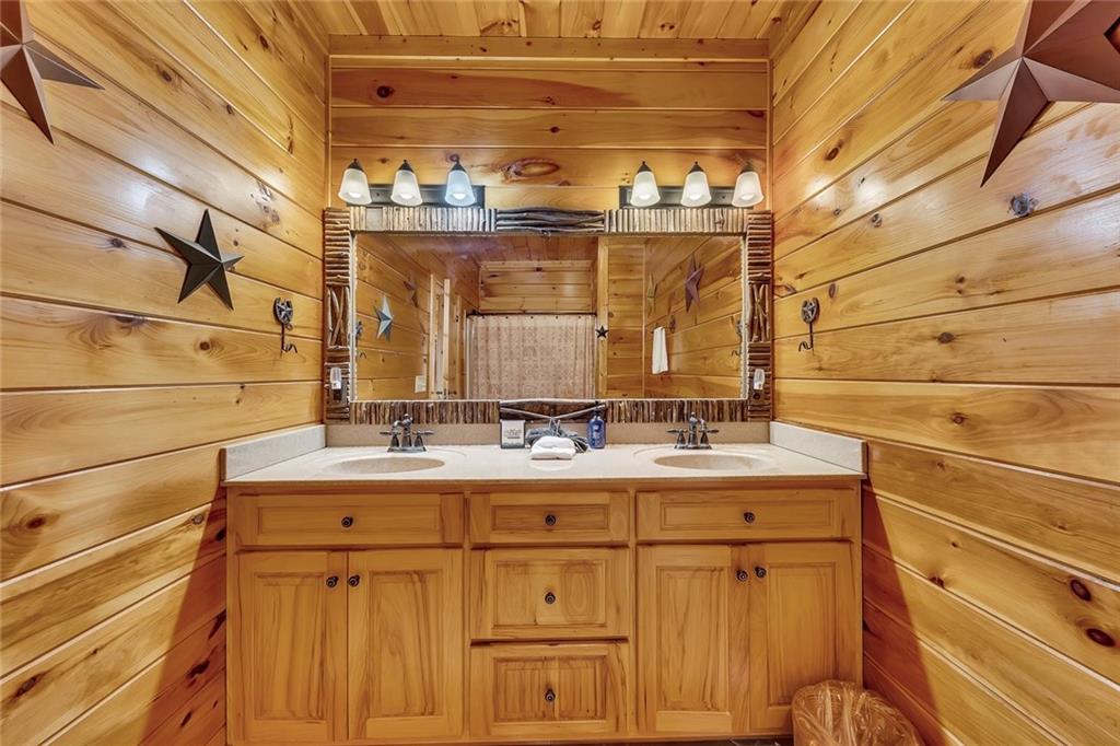499 Raven Ridge Circle Mineral Bluff, GA 30559 - Photo 15 of 43 a bathroom with a sink and a mirror