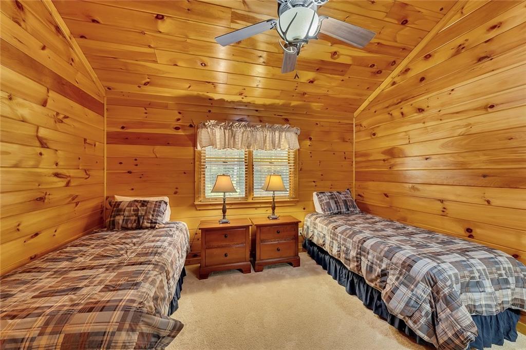 499 Raven Ridge Circle Mineral Bluff, GA 30559 - Photo 19 of 43 a bedroom with a bed and a window